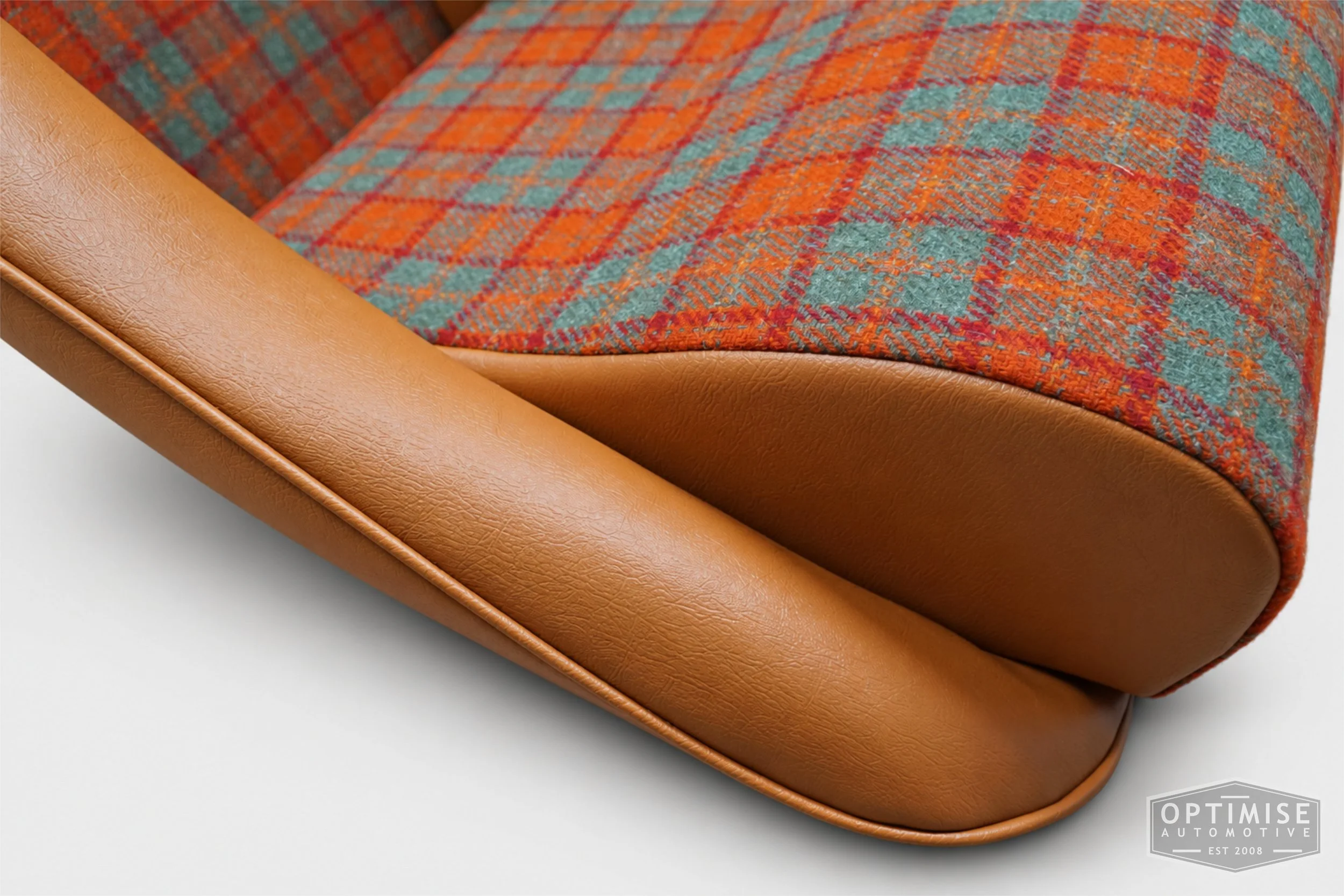 Classic Mini seat retrims featuring Cobra Classic front seats and a matching MK2 rear seat, trimmed in orange/green Harris Tweed A083 and light Jaguar tan leatherette.