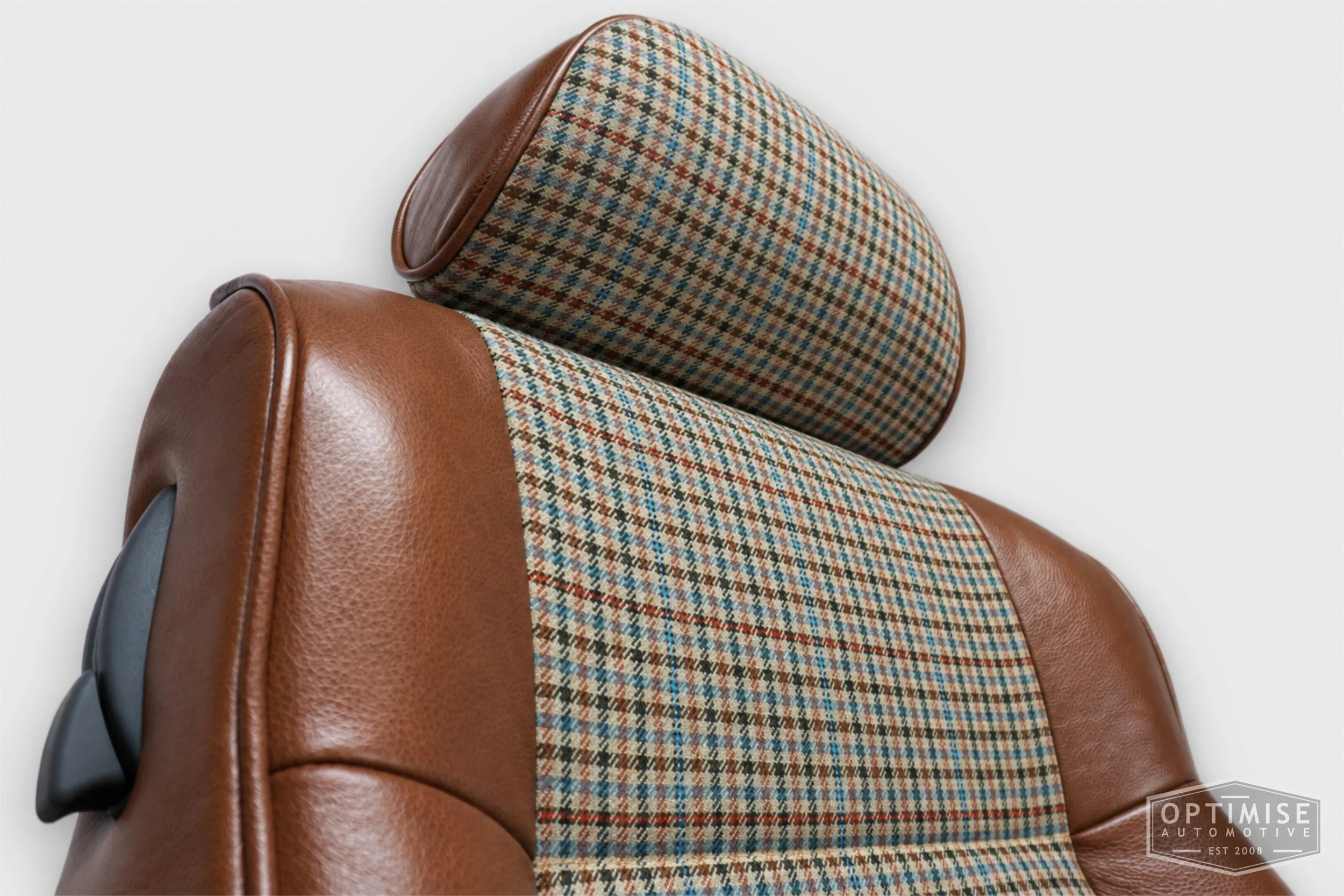Classic Mini seat retrims featuring original SPi front seats and a matching rear seat, trimmed in Crest Cambridge lark leather and Ashdown Check fabric 145.