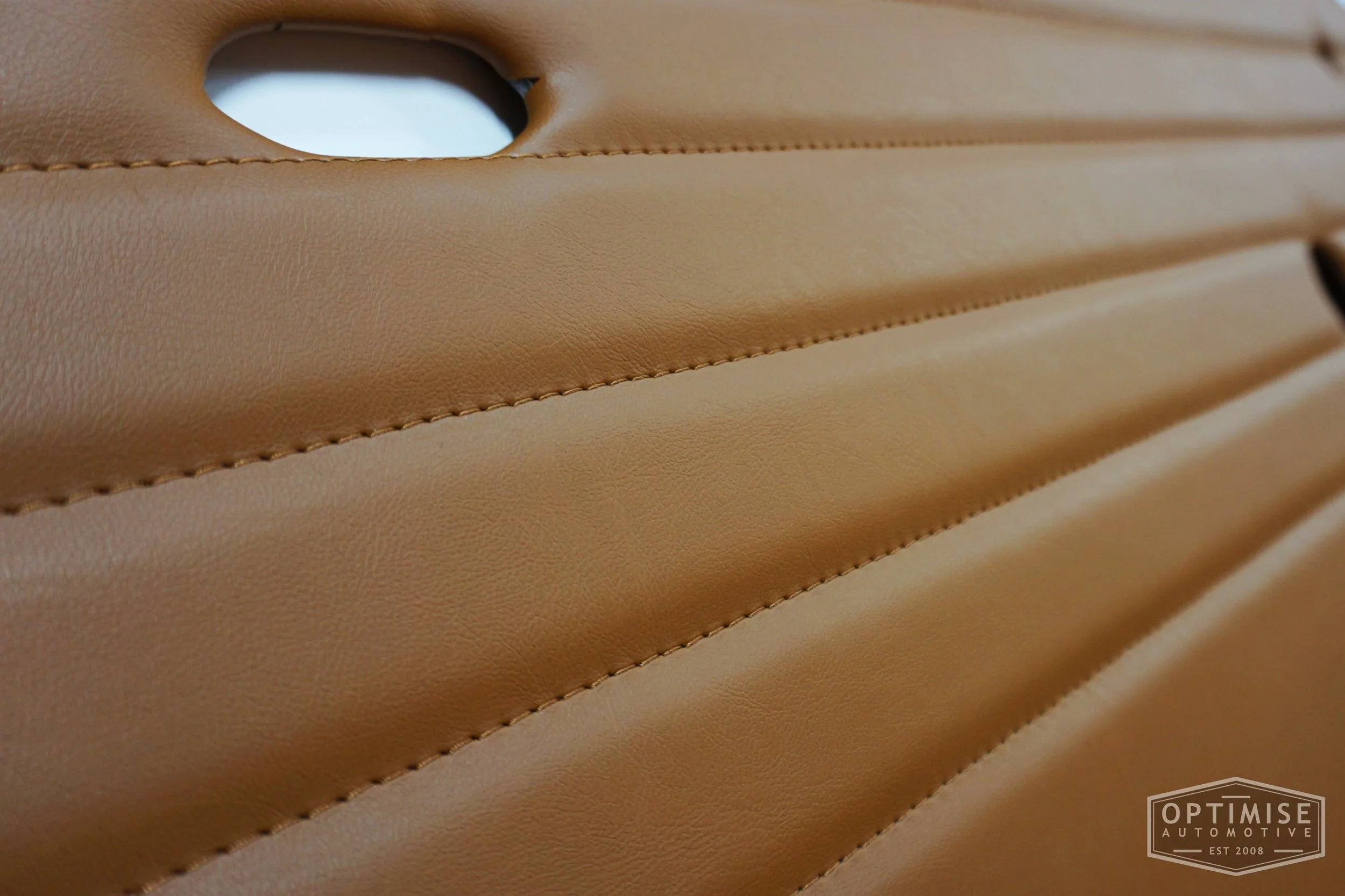 Classic Mini Monte-Carlo door cards, trimmed in light brown (tan) vinyl leatherette with light brown (tan) stitching.