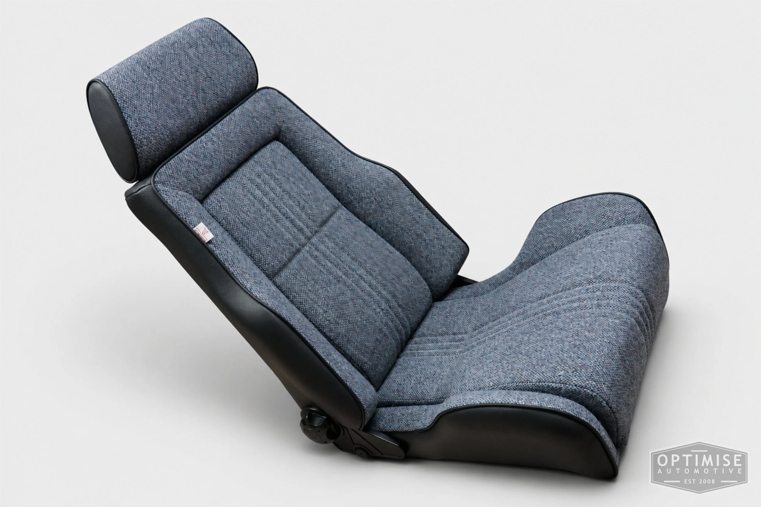 Classic Mini seat retrims featuring Cobra Le Mans front seats and a matching MK6 rear seat, trimmed in black leatherette and Harris Tweed blue Barleycorn BC1.