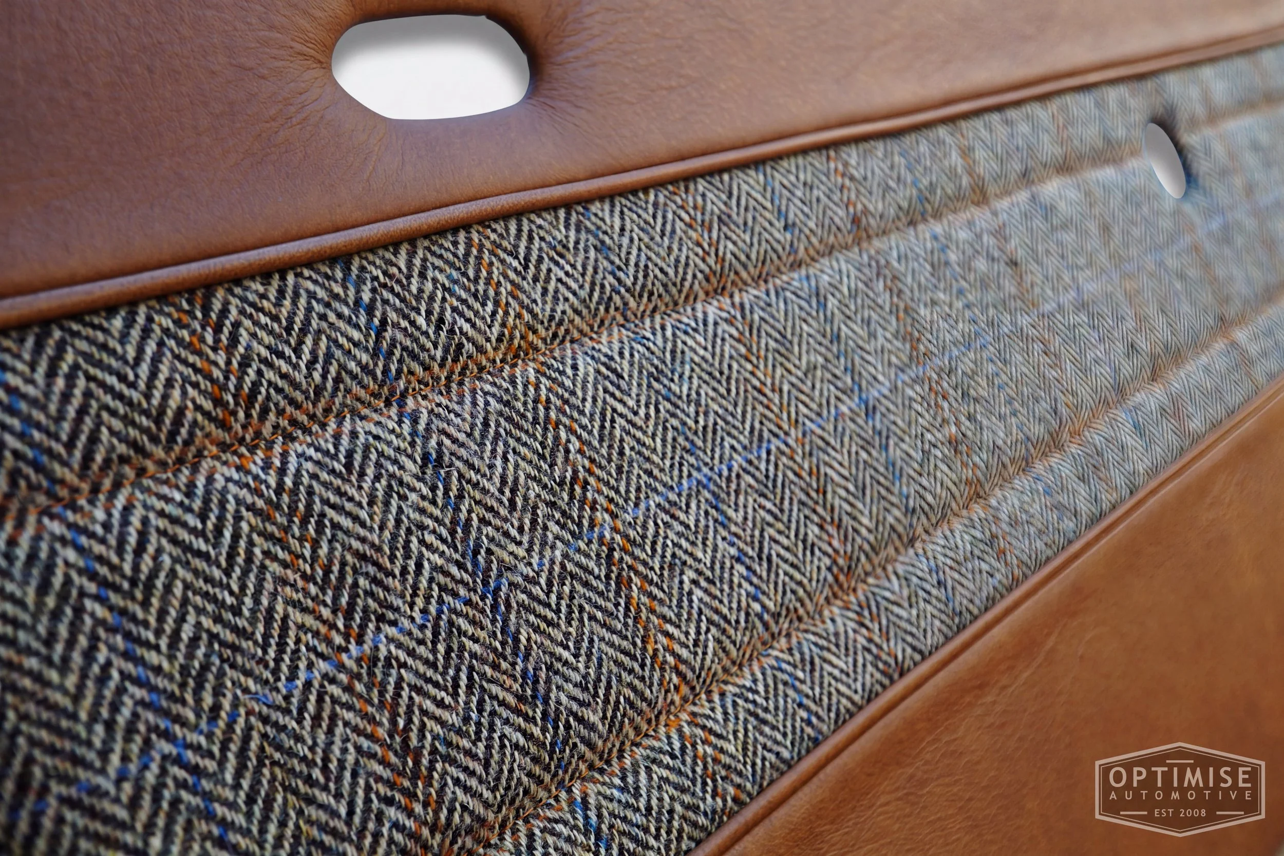 Classic Mini Wide-Stripe Fluted door cards, trimmed in Austen Bourbon leather and Harris Tweed HB133 with Austen Bourbon leather piping & tan stitching.