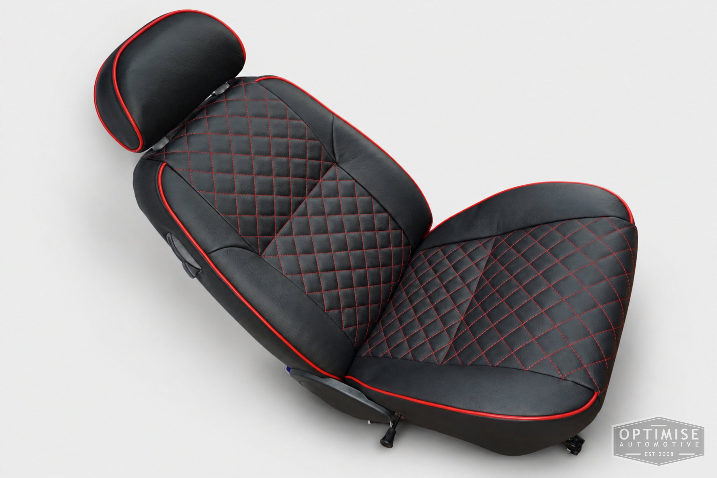Classic Mini seat retrims featuring original MPi front seats and a matching rear seat, trimmed in black auto grain leather with red diamond stitching and piping.