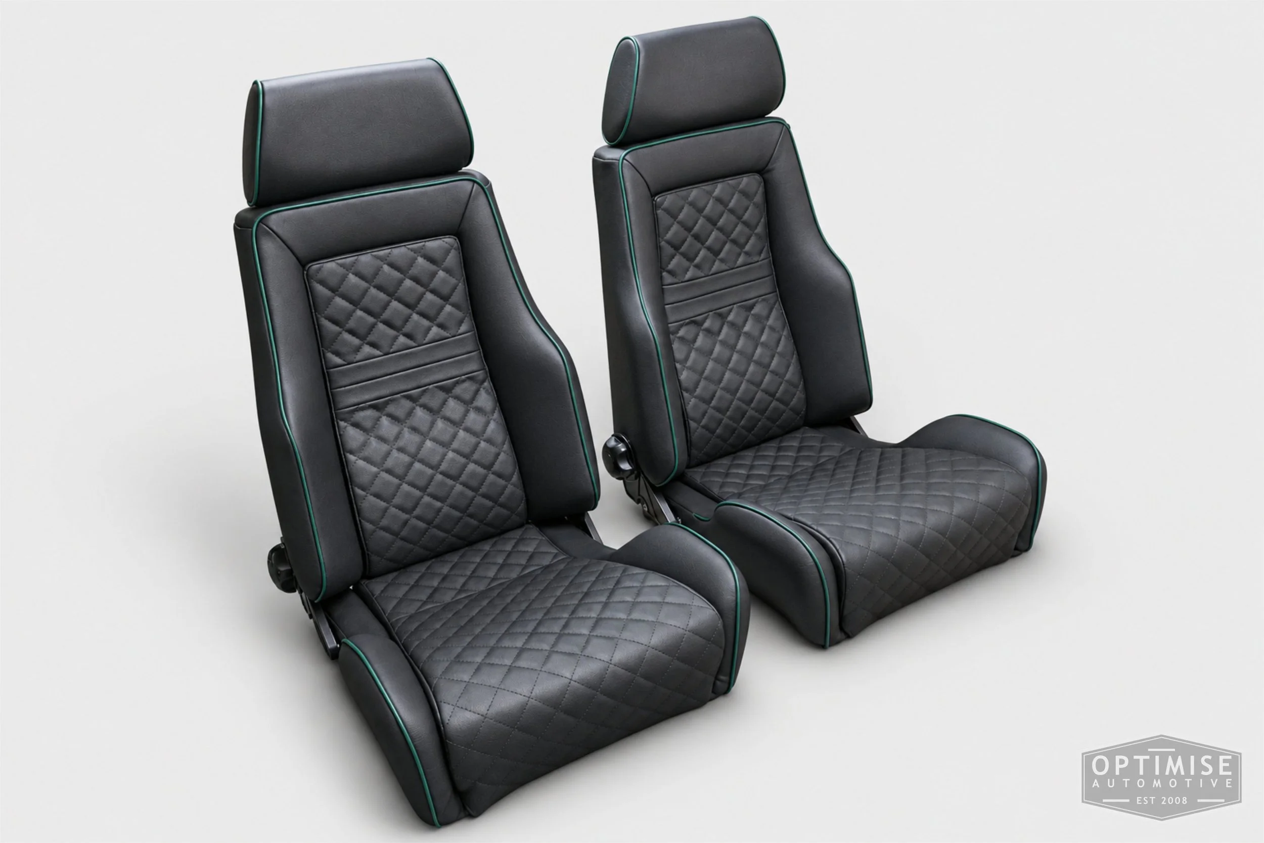 Classic Mini seat retrims featuring Cobra Le Mans front seats and a matching MK5 rear seat, trimmed in black leatherette with British Racing Green diamond stitching and matching green piping.