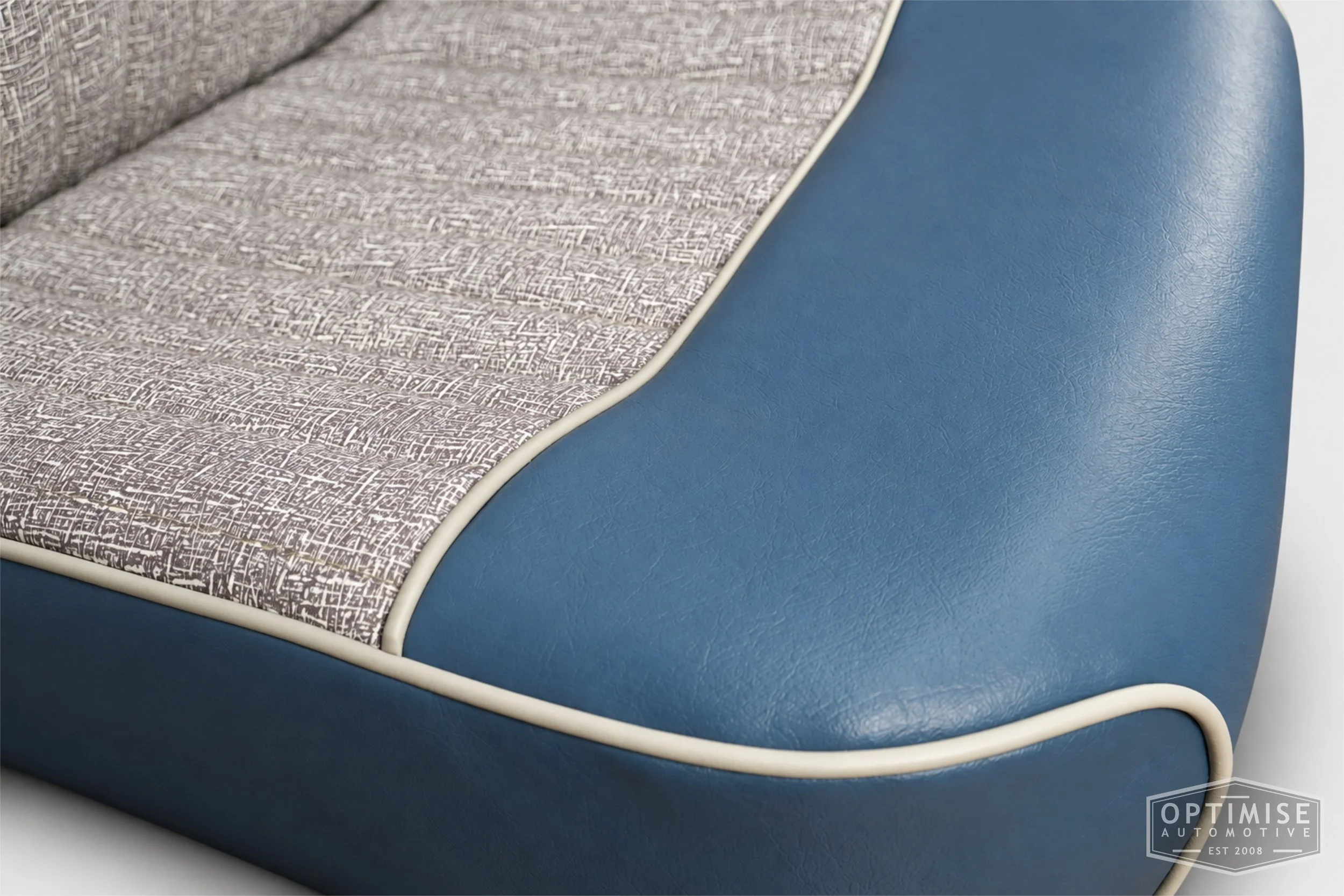 Classic Mini seat retrims featuring original non-reclining front seats and a matching MK1 rear seat, trimmed to original specifications in grey fleck and blue.