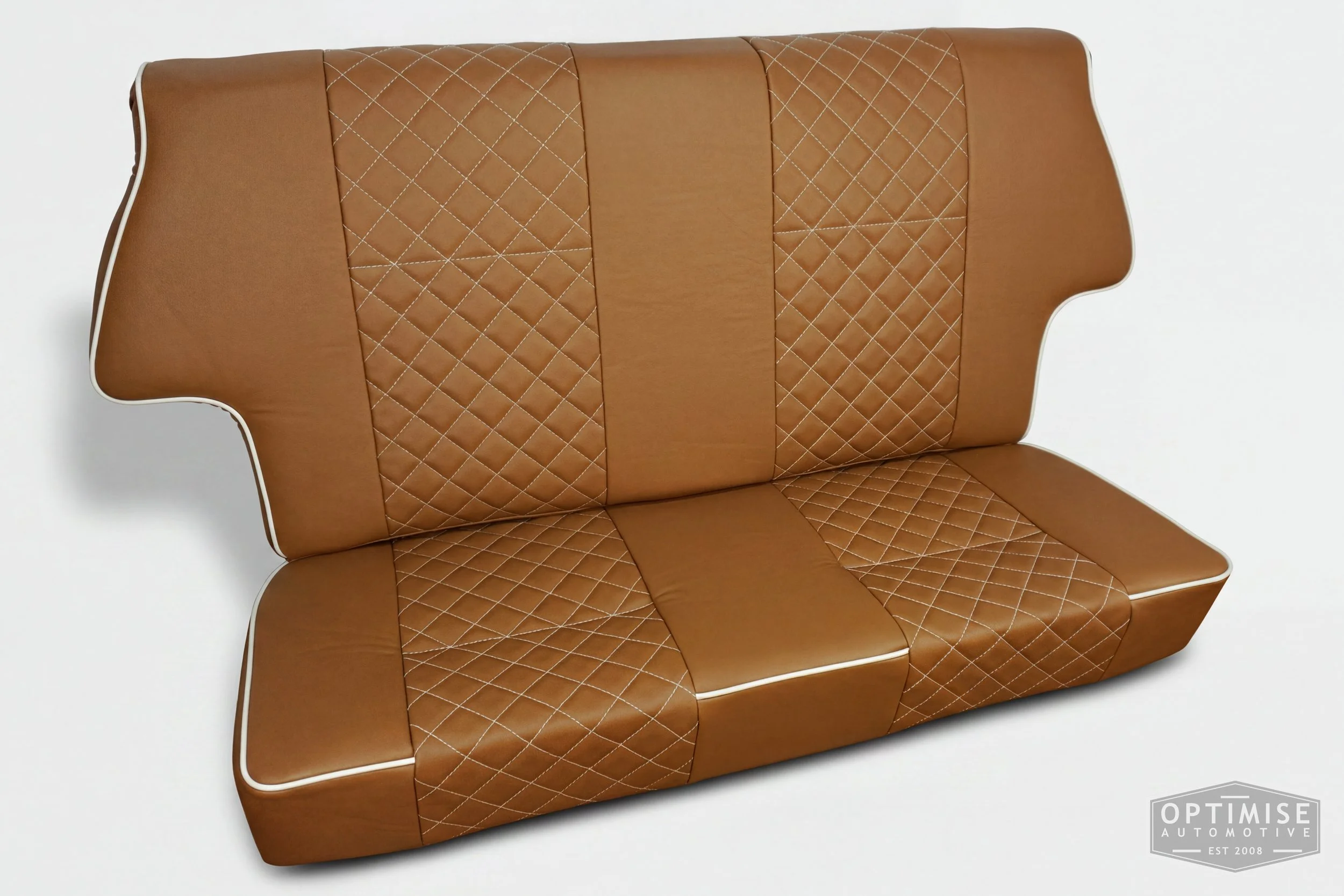 Classic Mini single post headrest seat retrims, trimmed in light brown (tan) leatherette with cream piping and cream diamond stitching.