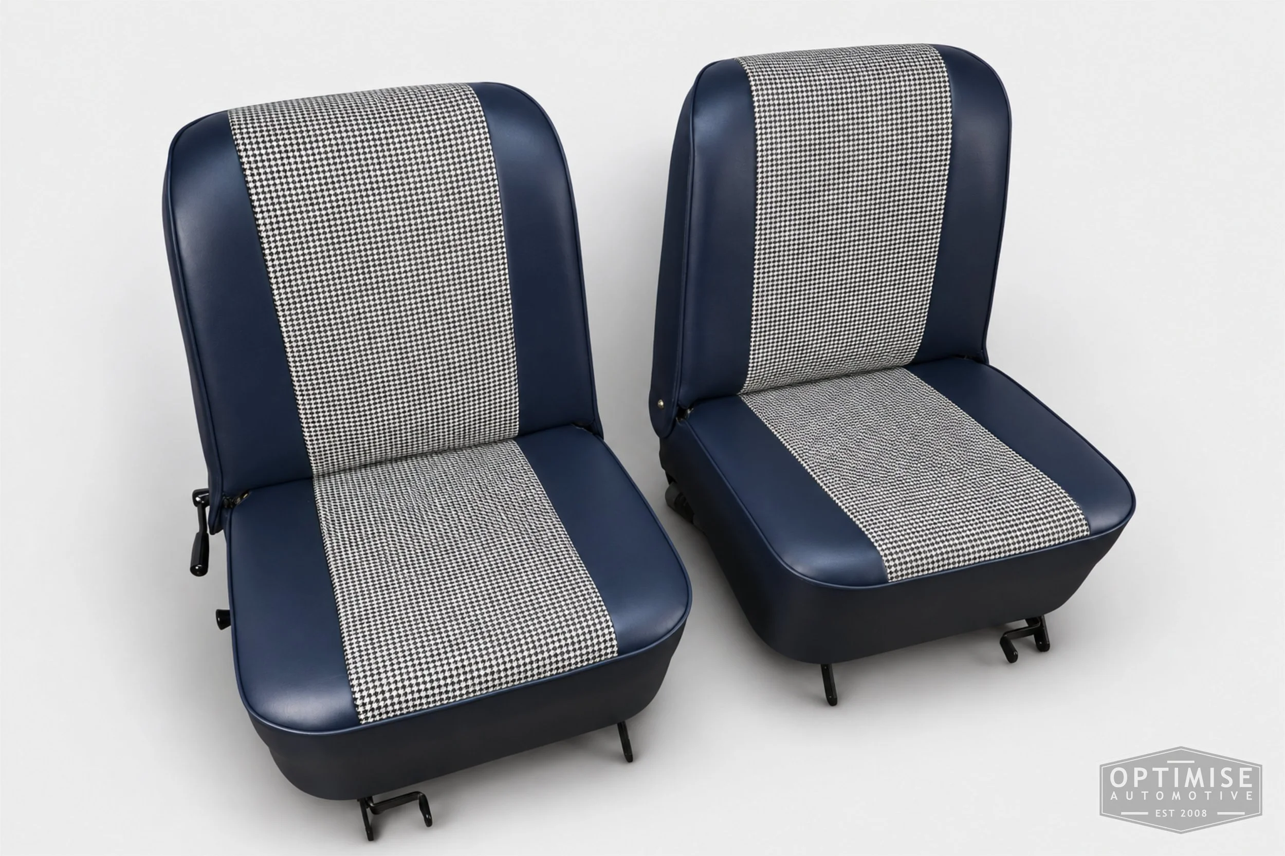 Classic Mini seat retrims featuring original reclining front seats and a matching rear seat, trimmed to original specifications in Mayfair black & white houndstooth cloth and midnight blue leatherette.