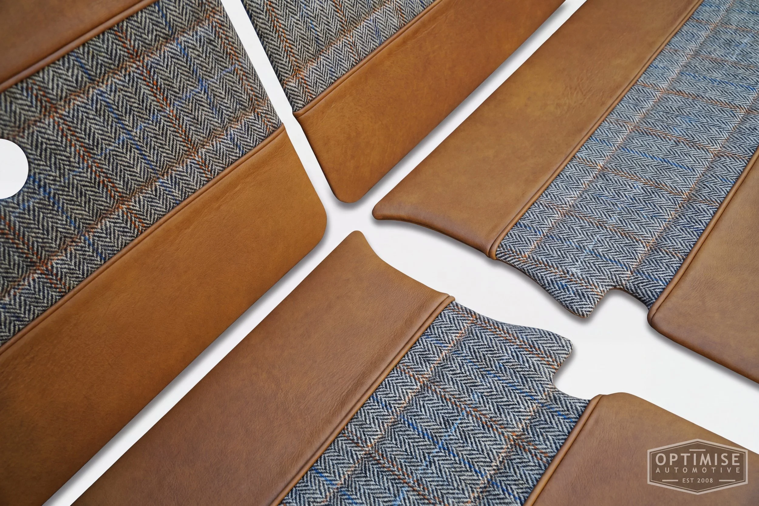 Classic Mini Wide-Stripe Fluted door cards, trimmed in Austen Bourbon leather and Harris Tweed HB133 with Austen Bourbon leather piping & tan stitching.