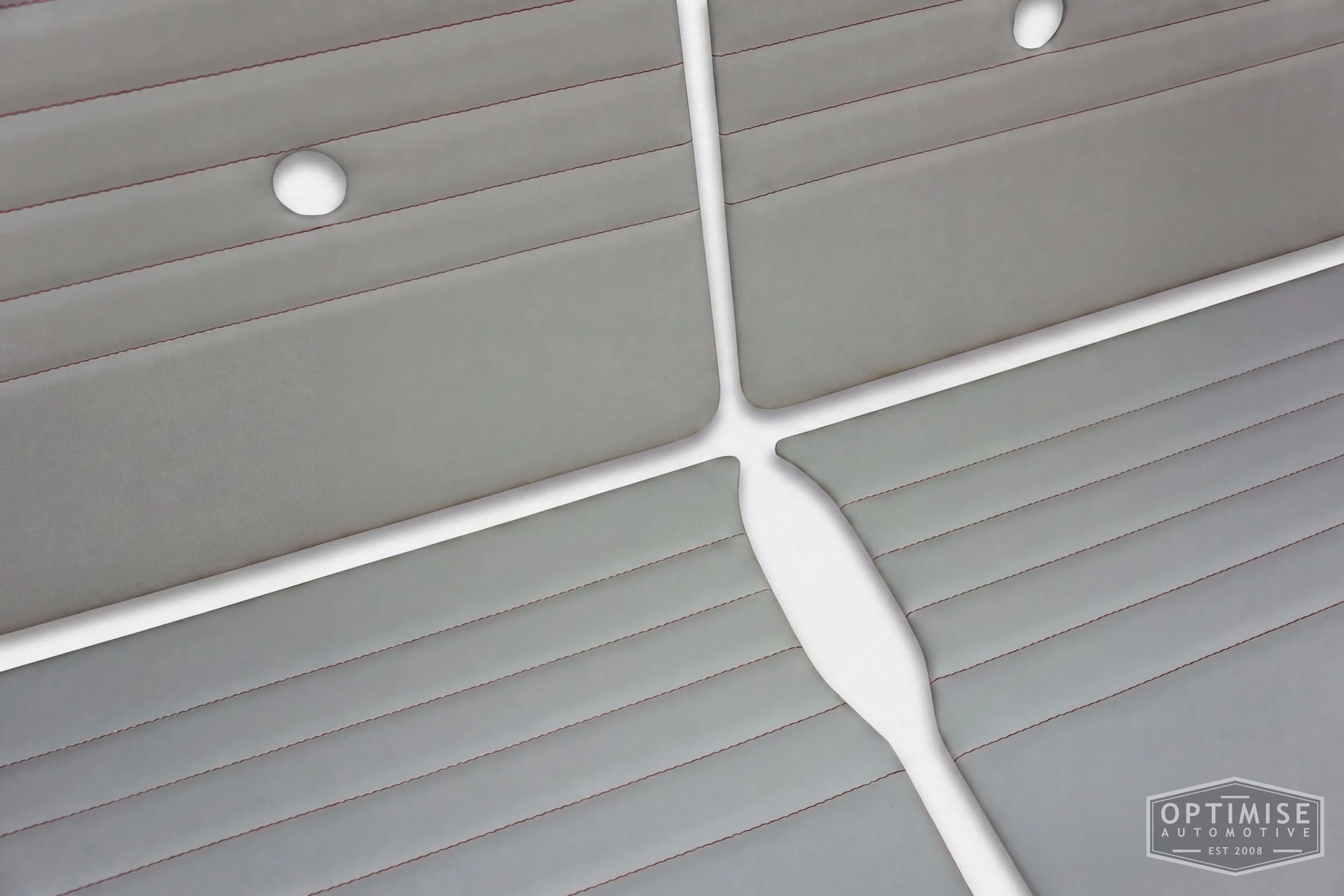 Classic Mini Monte-Carlo door cards, trimmed in light grey vinyl leatherette with red stitching.