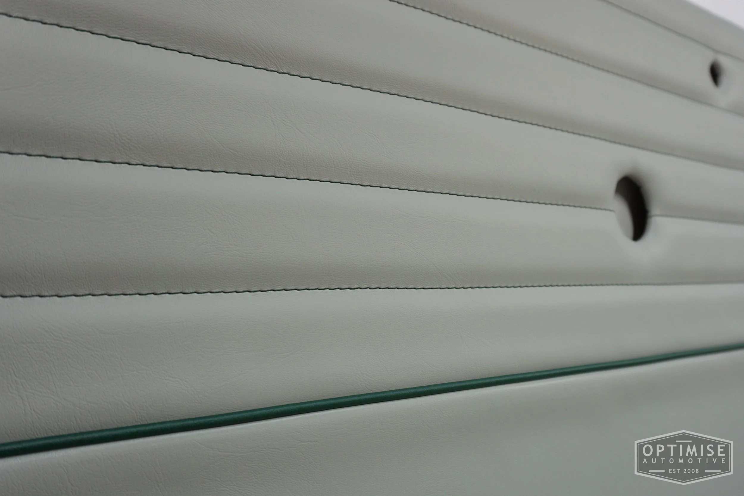 Classic Mini Monte-Carlo Plus door cards, trimmed in dove grey vinyl leatherette with British racing green piping & stitching.