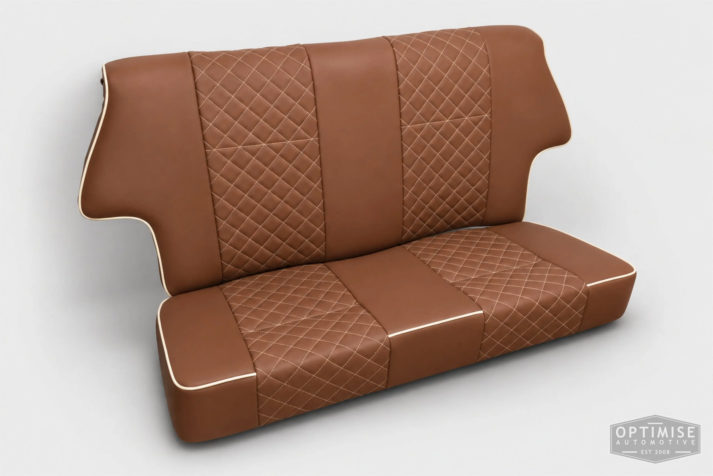 Classic Mini seat retrims featuring original single-post headrest front seats and a matching MK4 rear seat, trimmed in dark tan leatherette with cream diamond stitching and piping, with embroidered headrests.