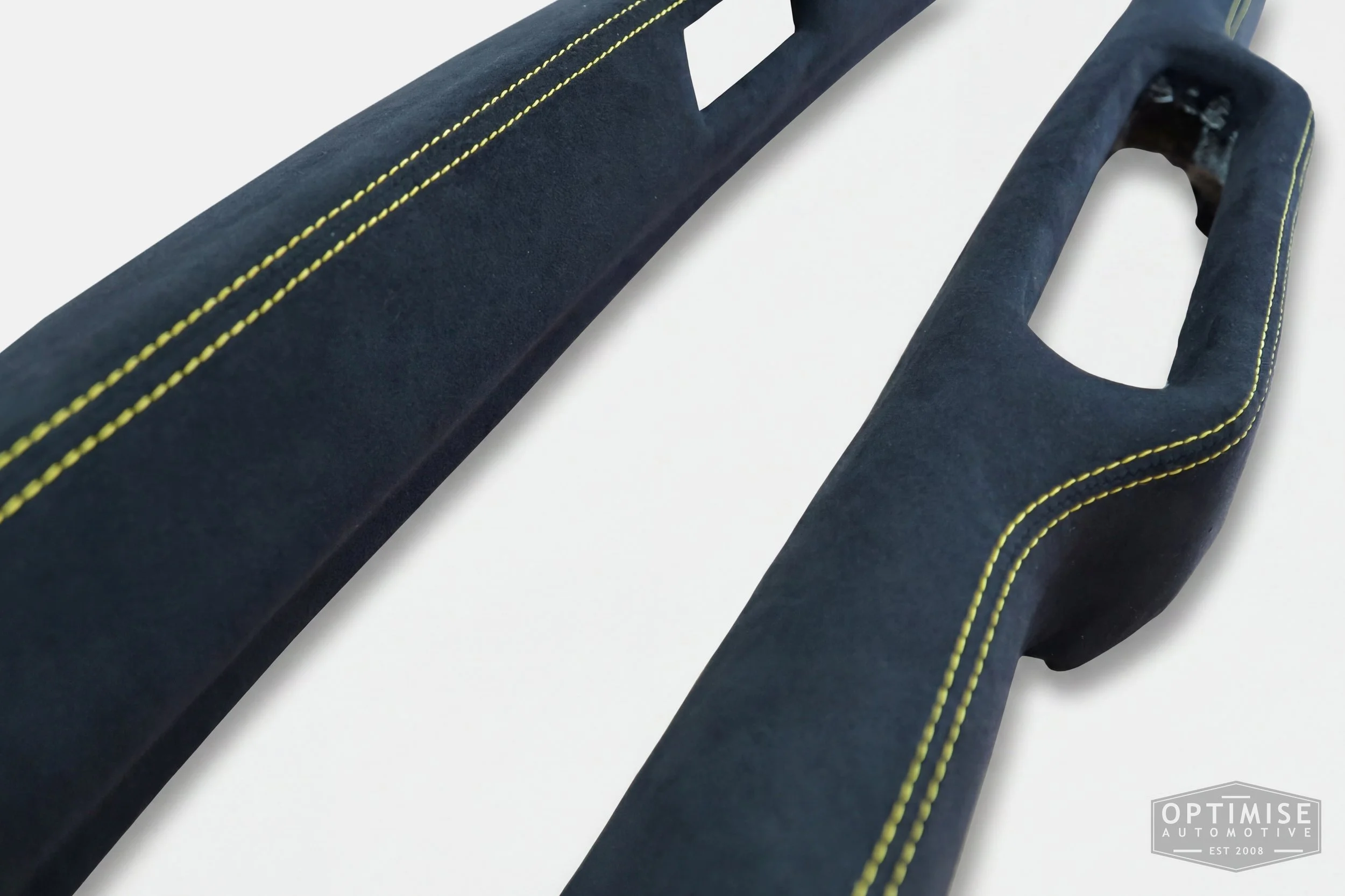 Classic Mini dash rail retrims, trimmed in black Alcantara with yellow stitching.