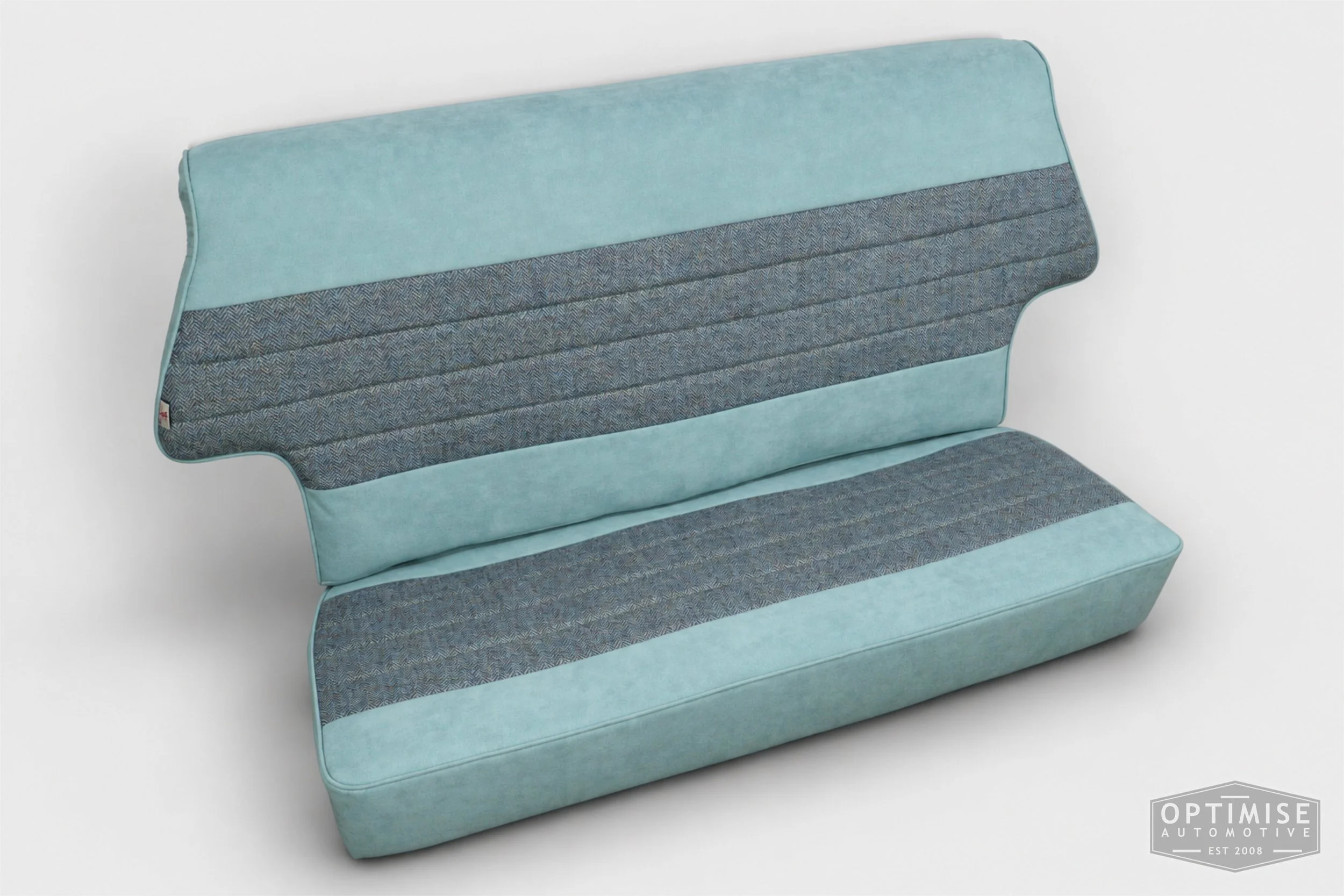 Classic Mini seat retrims featuring original single-post headrest front seats and a matching MK4 rear seat, trimmed in light blue Alcantara and Harris Tweed HB108.