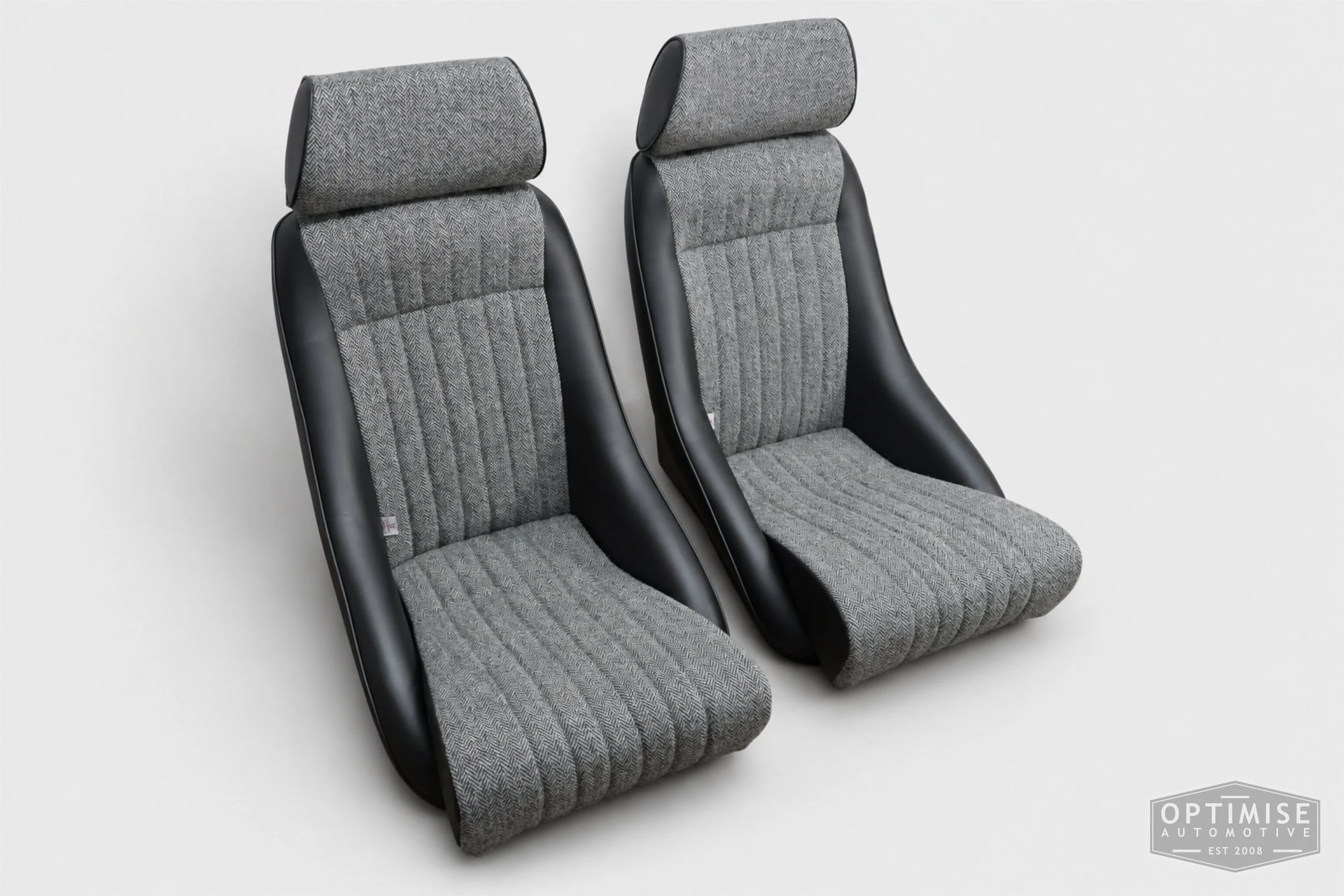 Classic Mini seat retrims featuring Cobra Monte Carlo front seats, trimmed in black leatherette and Harris Tweed HB1.