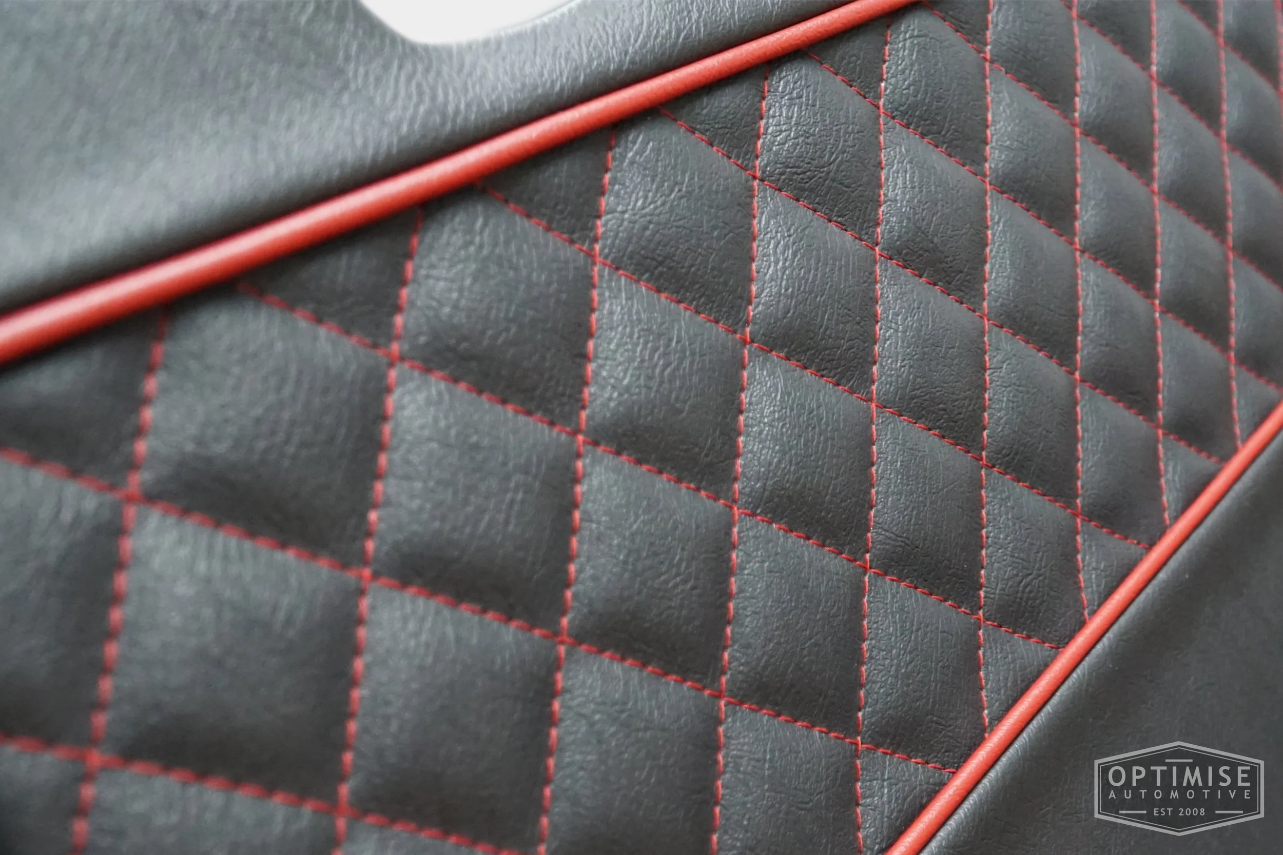Classic Mini Wide-Stripe Fluted door cards, trimmed in black leather with red piping & diamond stitching.