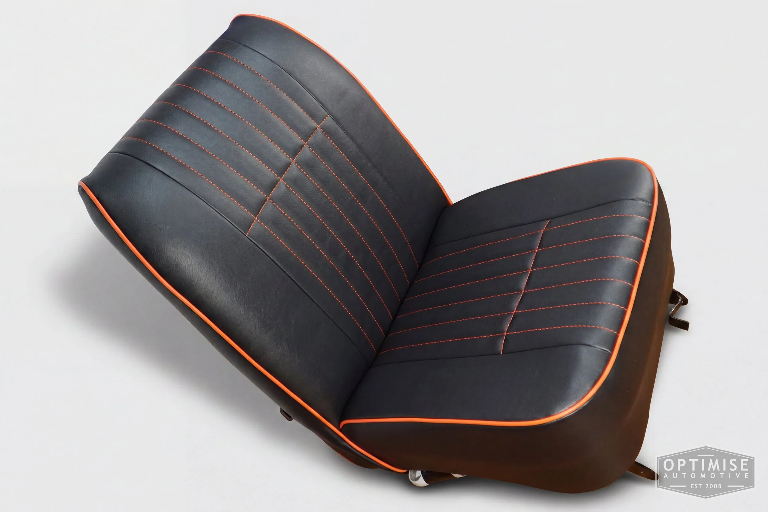 Classic Mini non-reclining seat retrims, trimmed in black leatherette with orange piping and orange stitching.