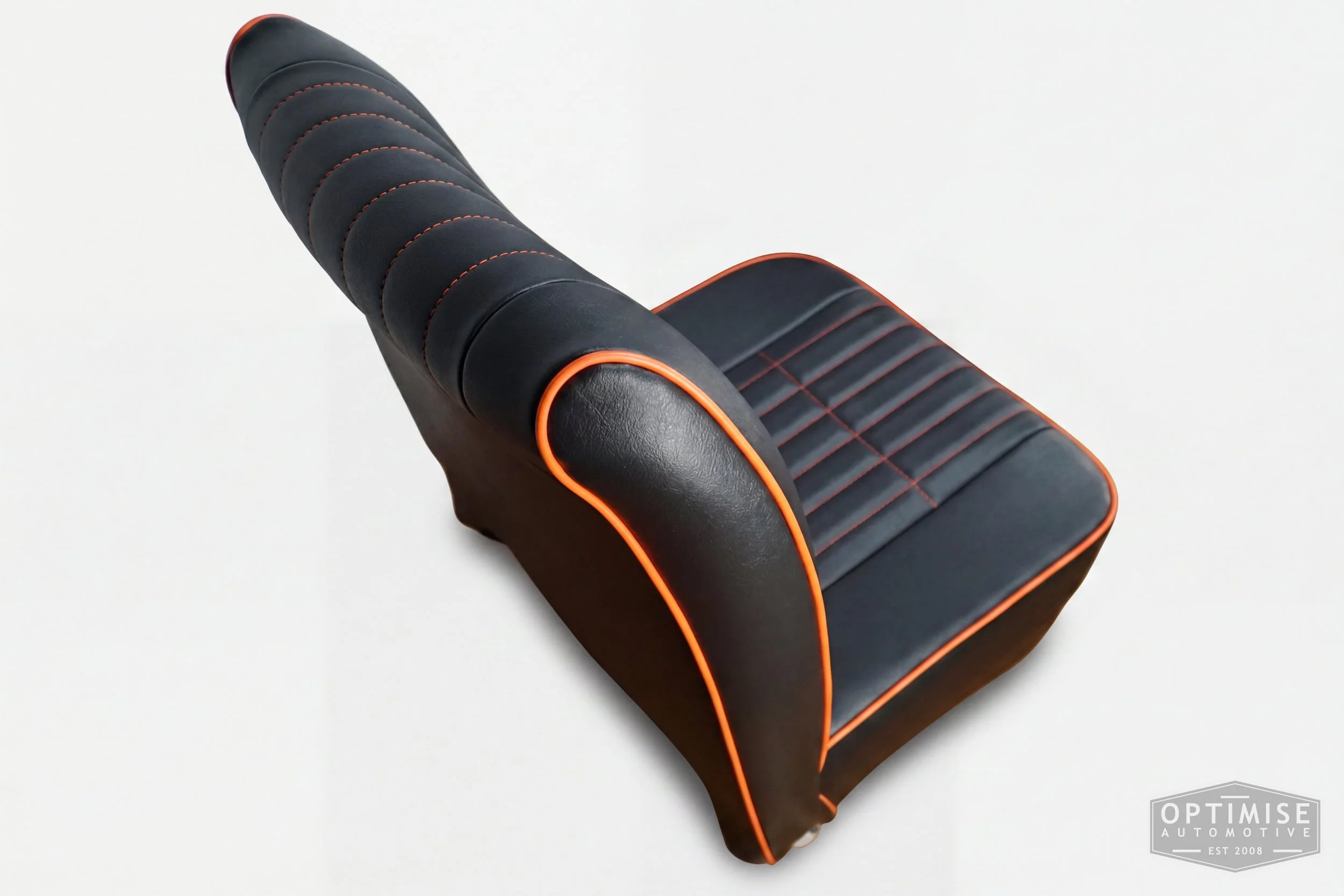 Classic Mini non-reclining seat retrims, trimmed in black leatherette with orange piping and orange stitching.