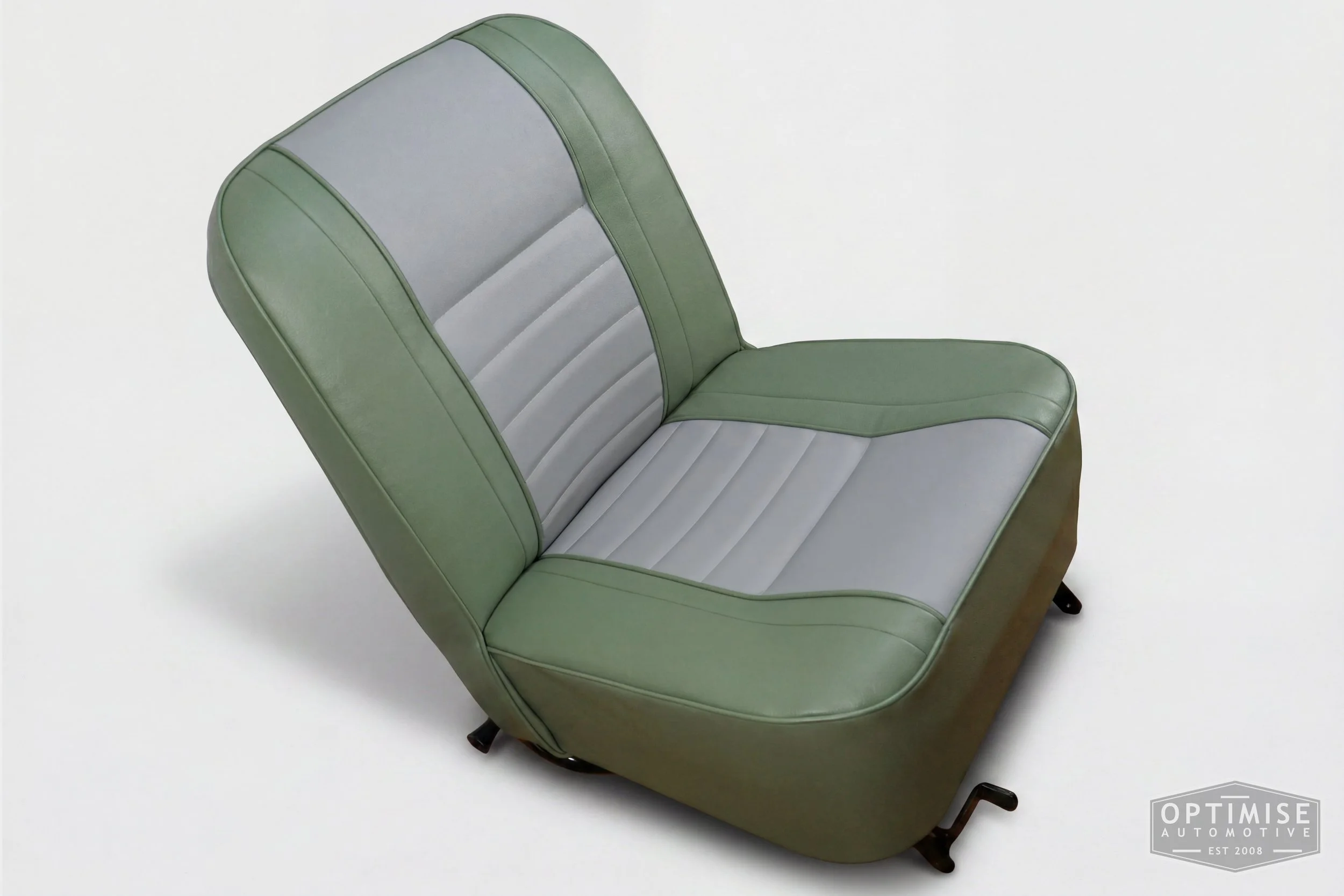 Classic Mini non-reclining seat retrims, trimmed in porcelain green and dove grey vinyl leatherette.