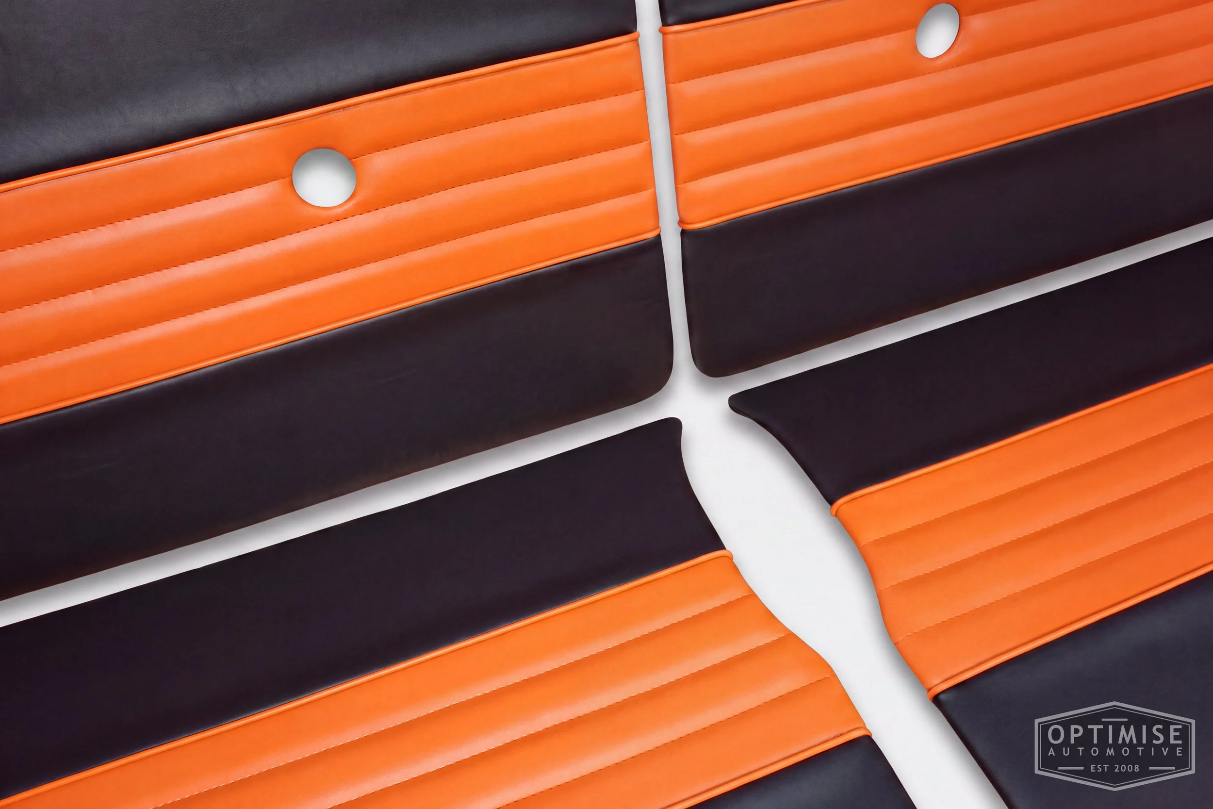 Classic Mini Wide-Stripe Fluted door cards, trimmed in black and orange vinyl leatherette with orange piping & stitching.