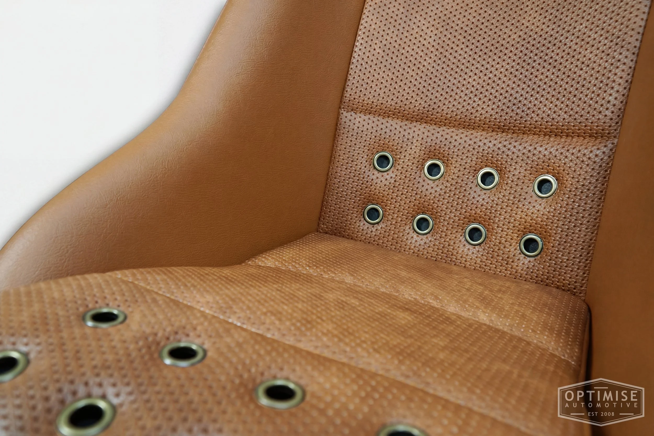 Classic Mini Cobra Classic seat retrims, trimmed in light brown (tan) leatherette and light brown (tan) basketweave leatherette with bronze eyelets.