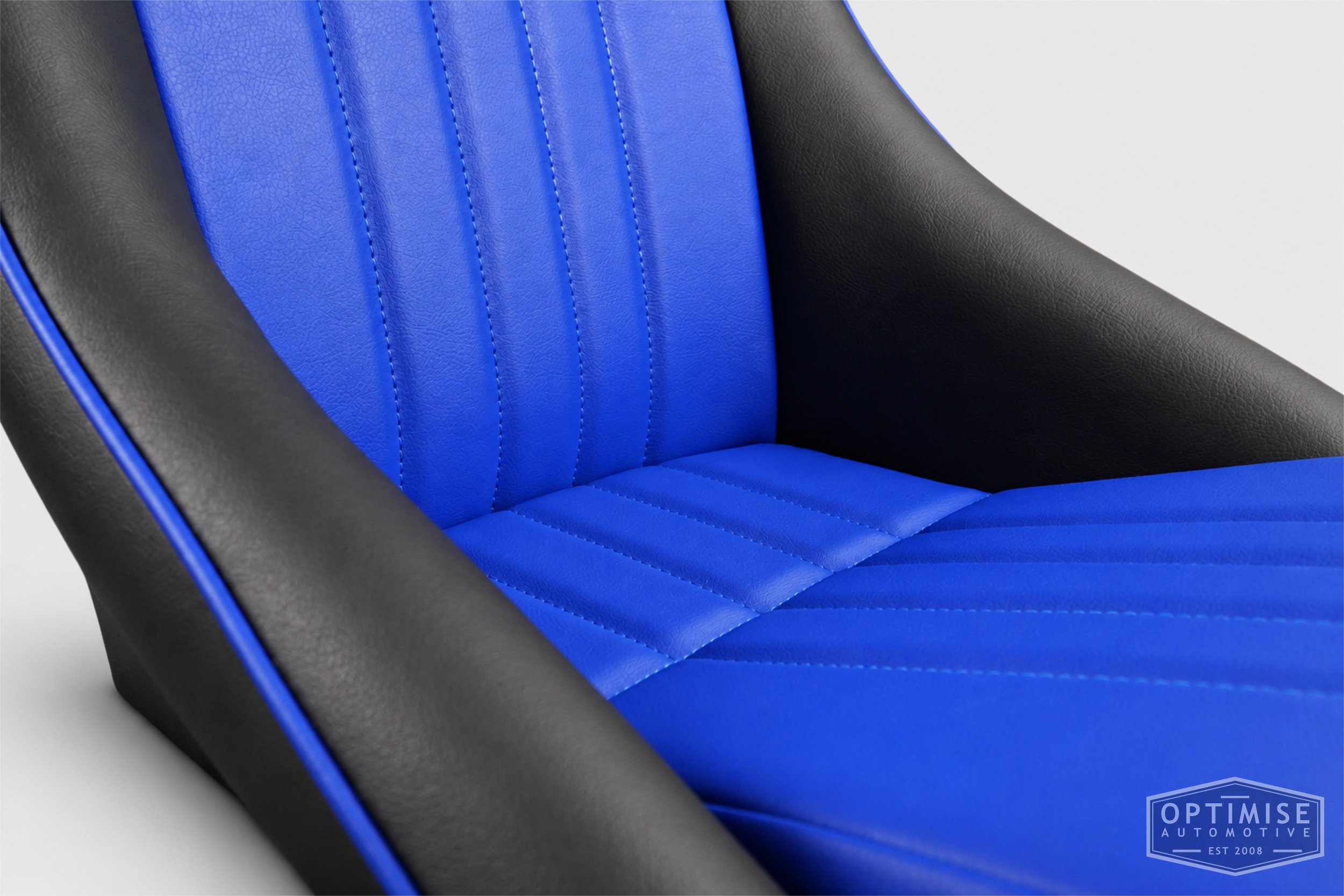 Classic Mini seat retrims featuring Cobra Monte Carlo front seats, trimmed in black and electric blue leatherette.