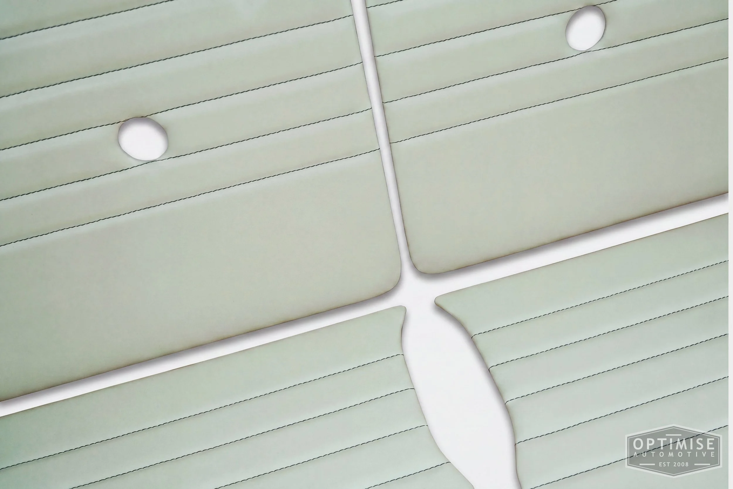 Classic Mini Monte-Carlo door cards, trimmed in cream vinyl leatherette with British racing green stitching.