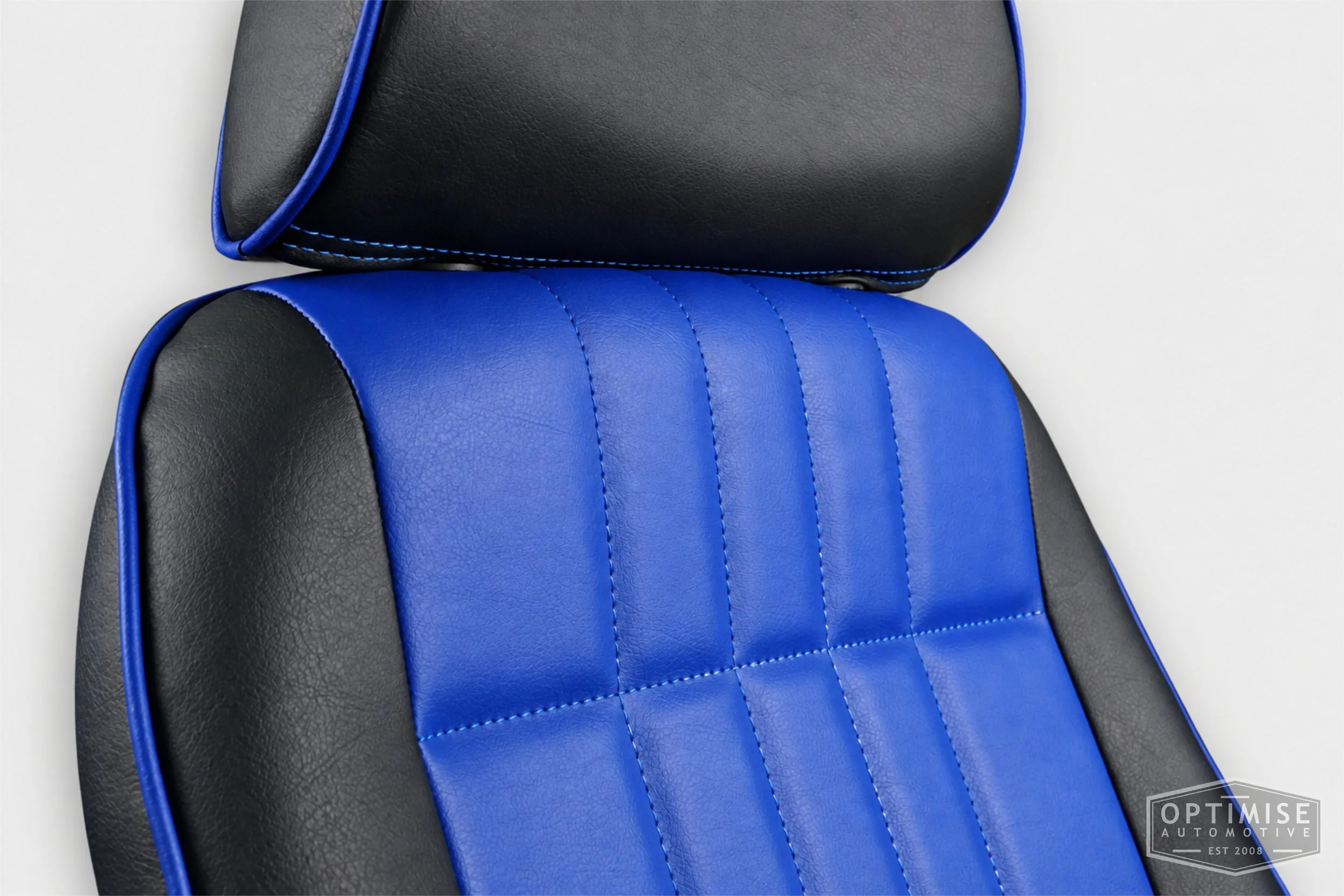 Classic Mini seat retrims featuring Cobra Monte Carlo front seats, trimmed in black and electric blue leatherette.