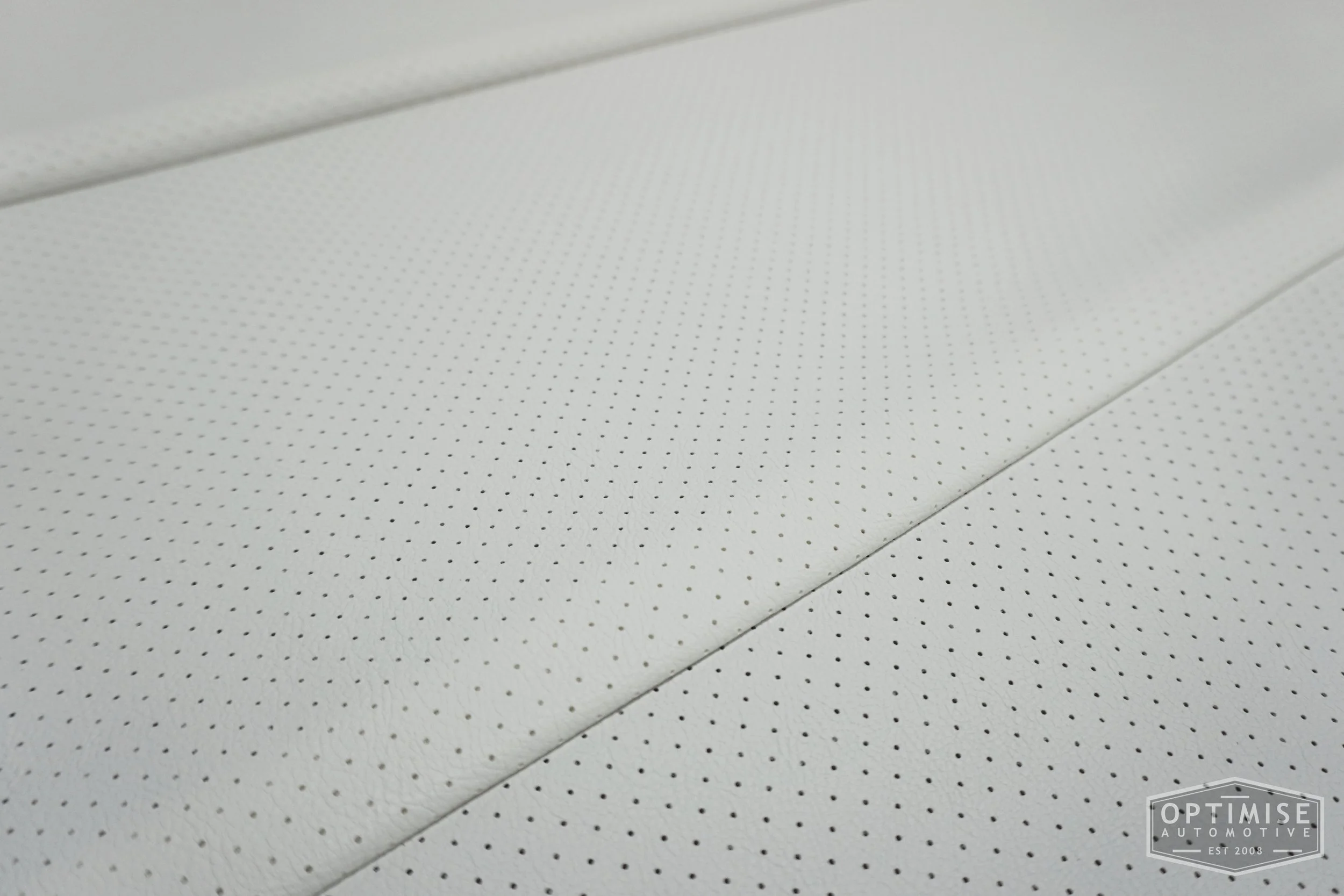 Classic Mini headlining kit, trimmed in white OEM perforated vinyl leatherette.