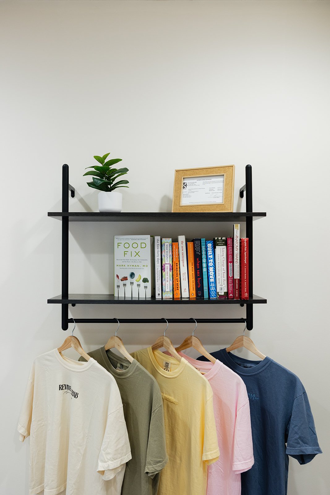Shirts and books at PT clinic in Columbia, MO