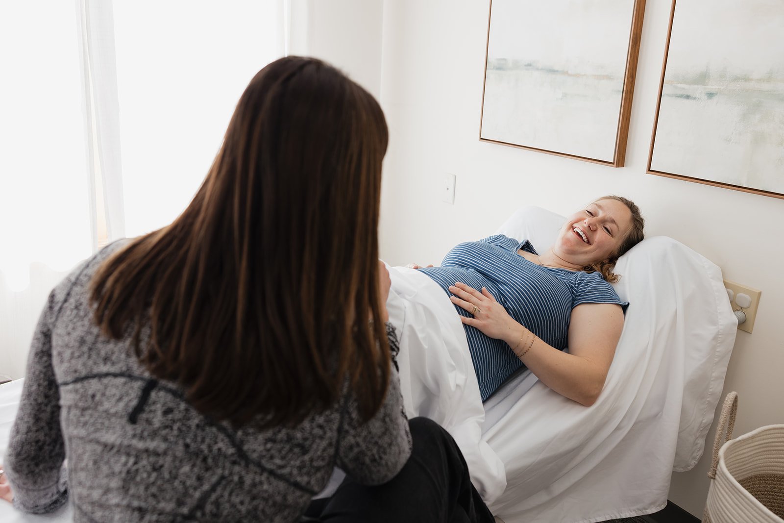 Pregnant woman in pelvic floor physical therapy smiling in Columbia, MO