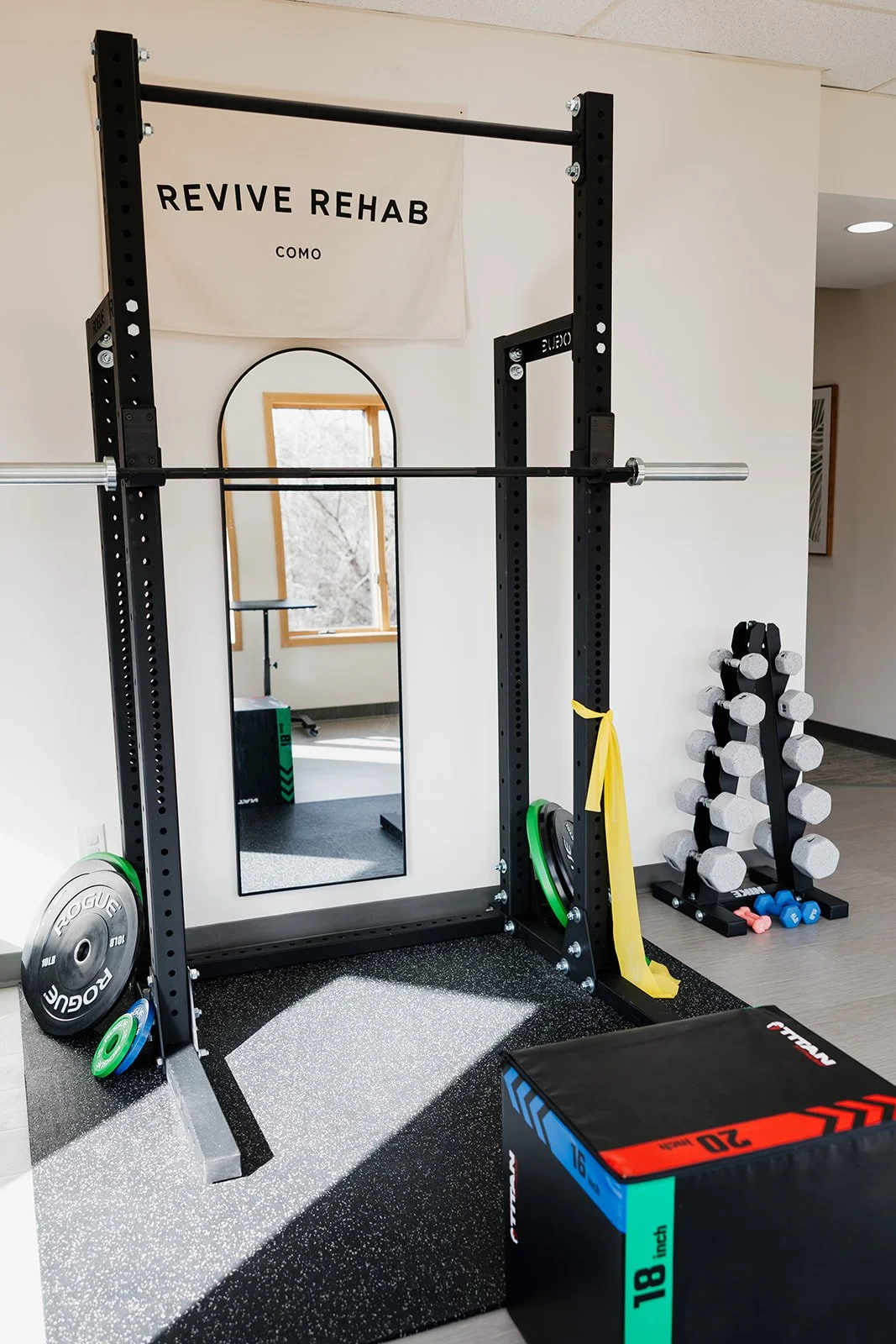 Squat rack and exercise equipment in PT clinic in Columbia, MO