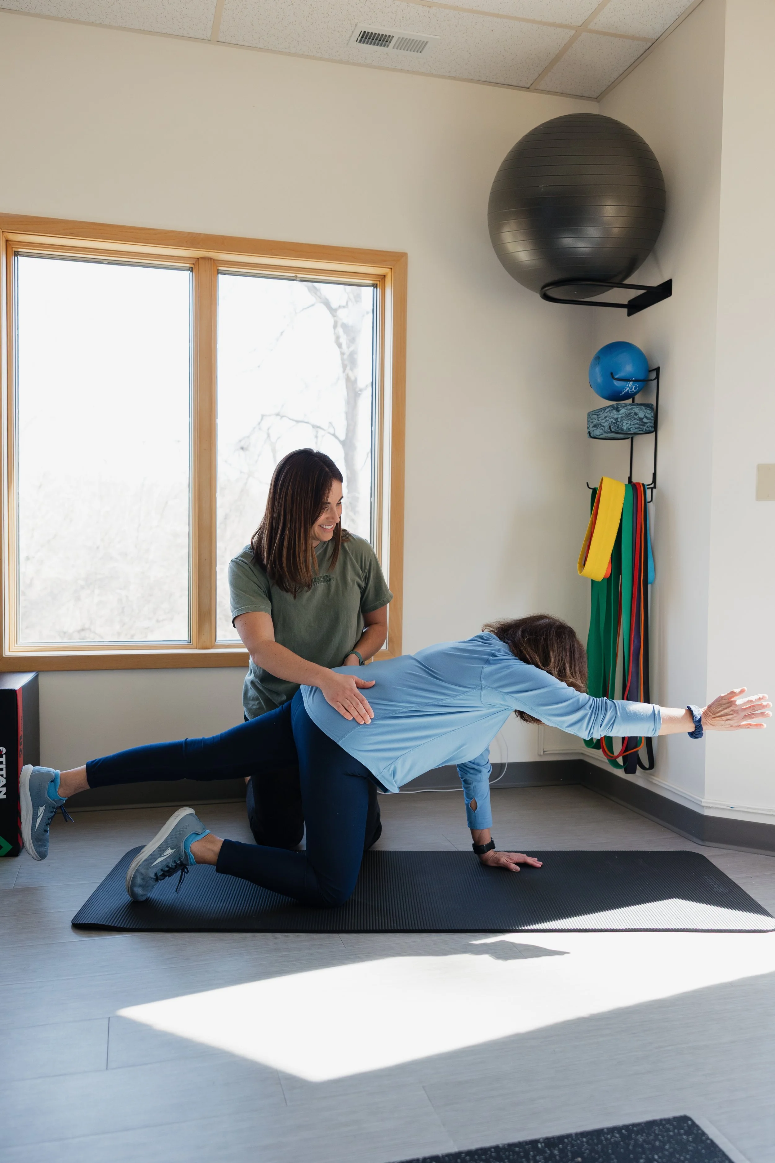 Menopause woman doing physical therapy exercises in a gym for pelvic health menopause physical therapy