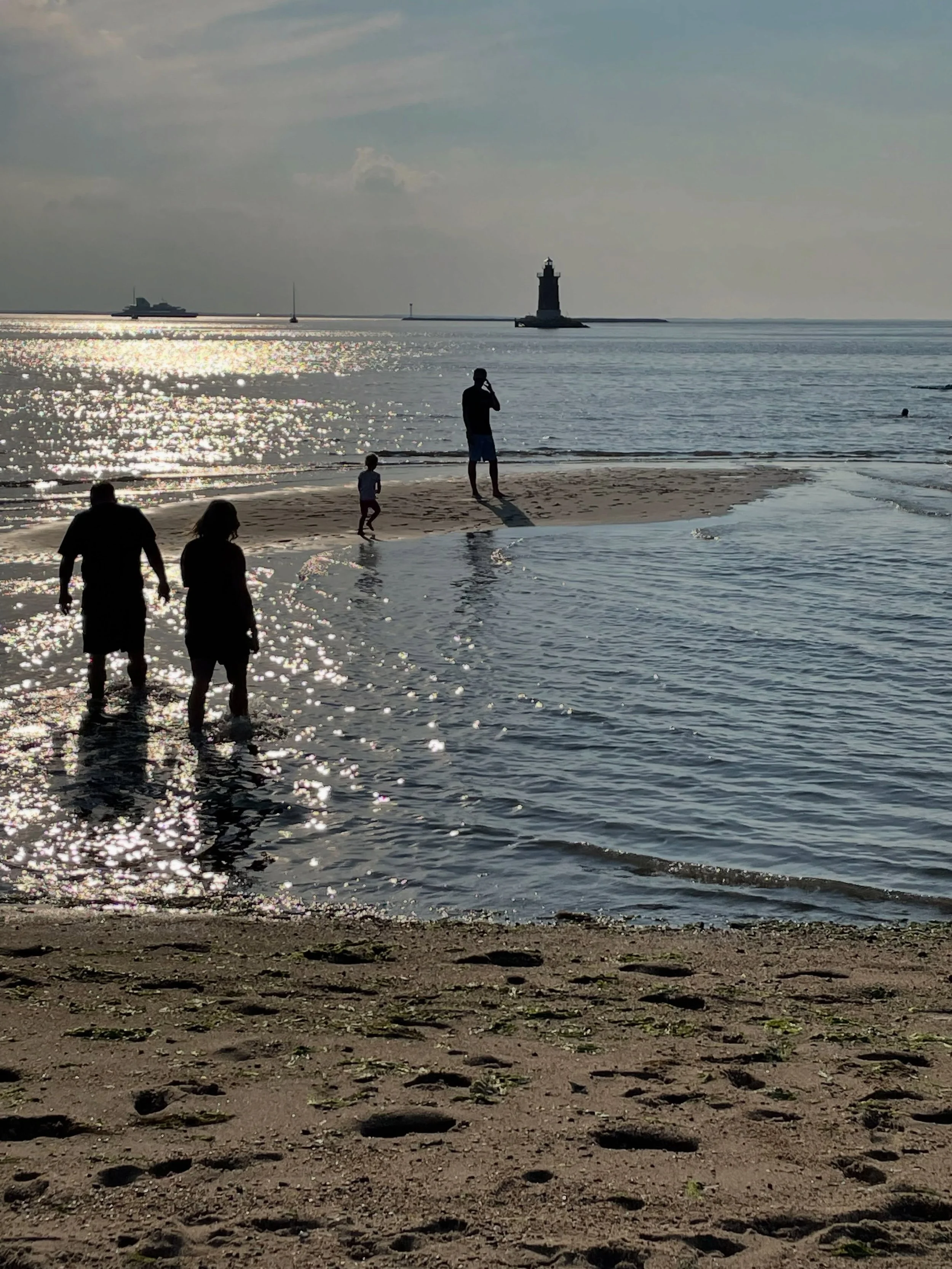 Cape Henlopen State Park in Delaware, has a fantastic lighthouse, where the sun sets over. Every year on vacation, we would take a night with our kids to visit and now we are passing the tradition on. You can wade out on endless sand bars towards the