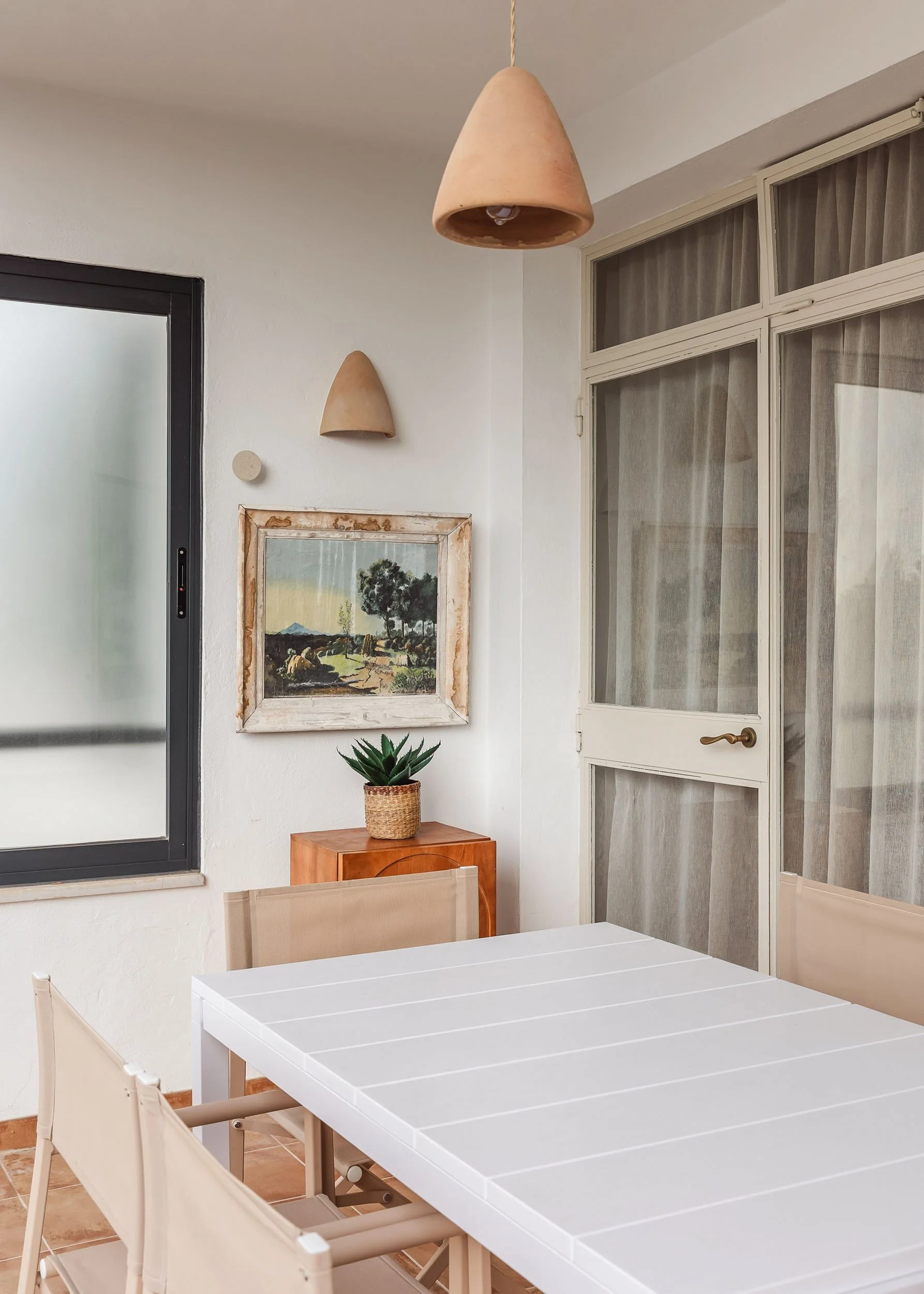 Dining corner with natural wood furniture and soft light