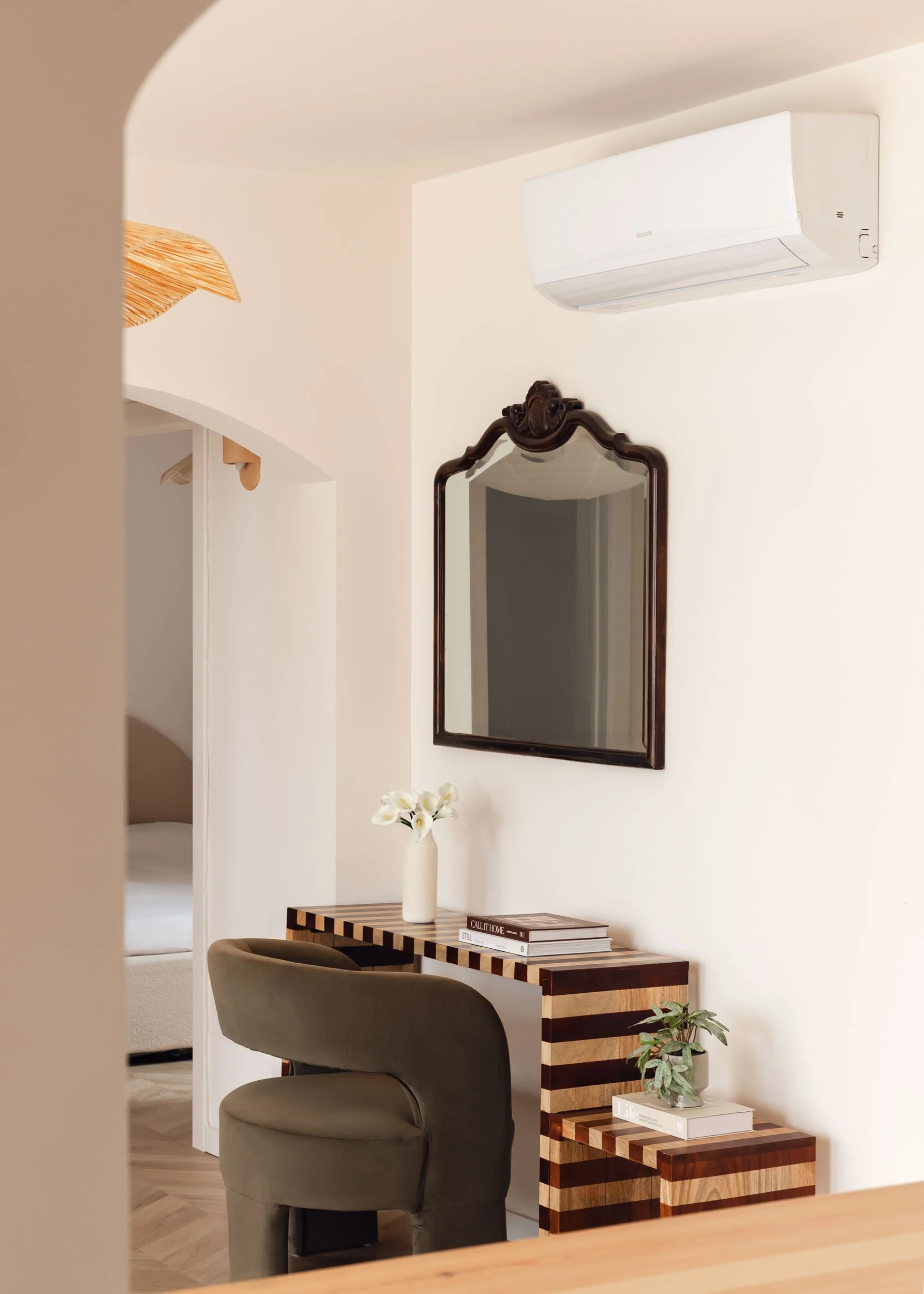 Console table with vintage mirror and sculptural details