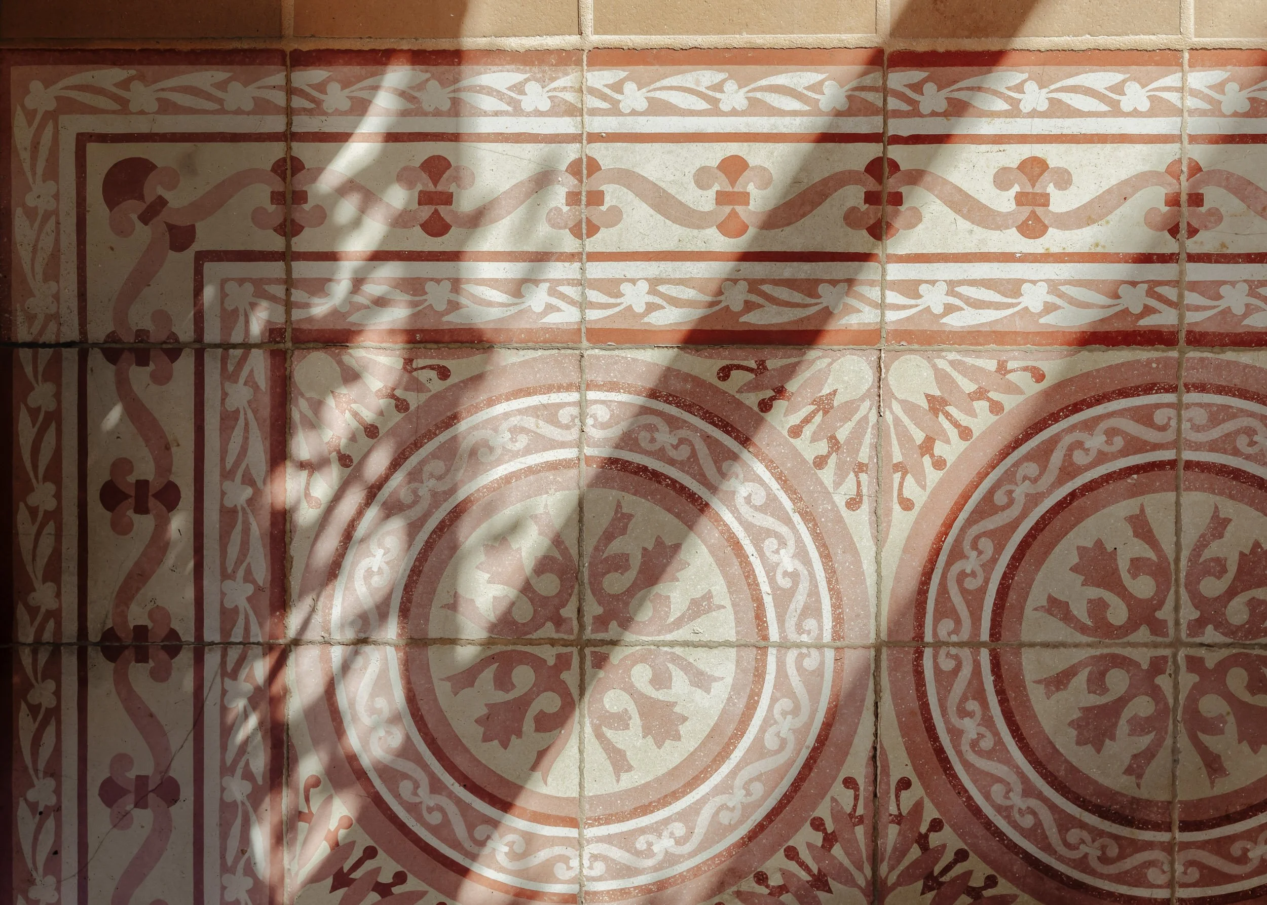 Decorative patterned tiles with natural light and shadow play