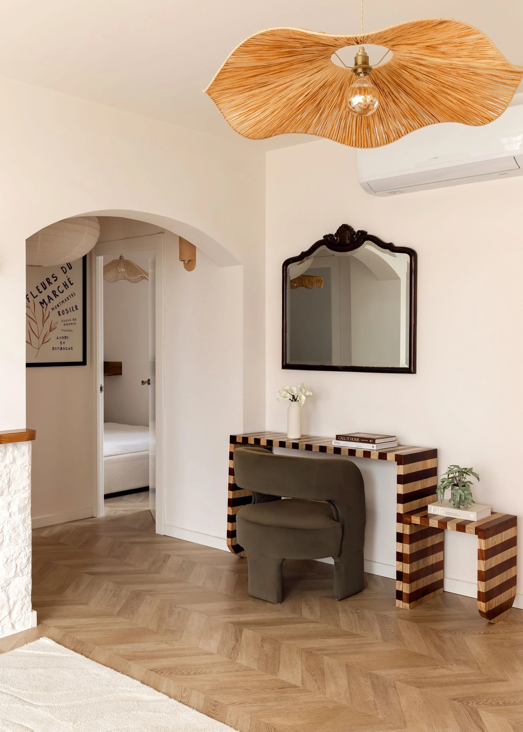 Interior passage with desk nook and arched architecture