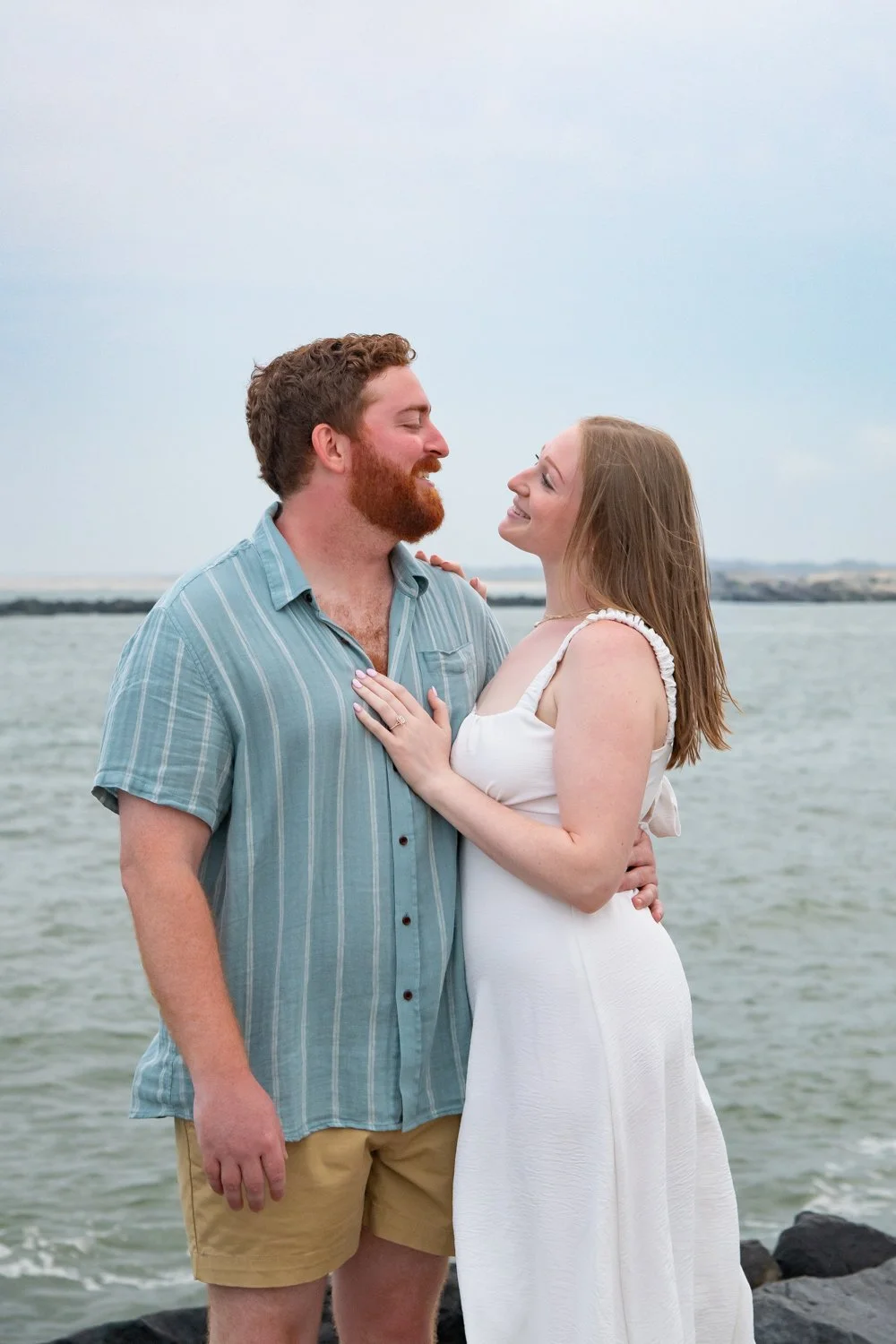 Engagement session on the jetty at the Ocean City Inlet and Boardwalk by Rayne Photography