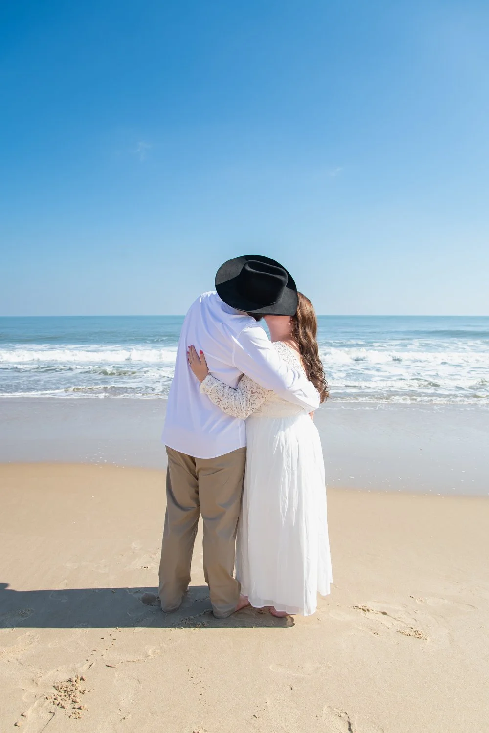 Wedding and anniversary couples photo sessions on the beach in Ocean City, Maryland by Rayne Photography