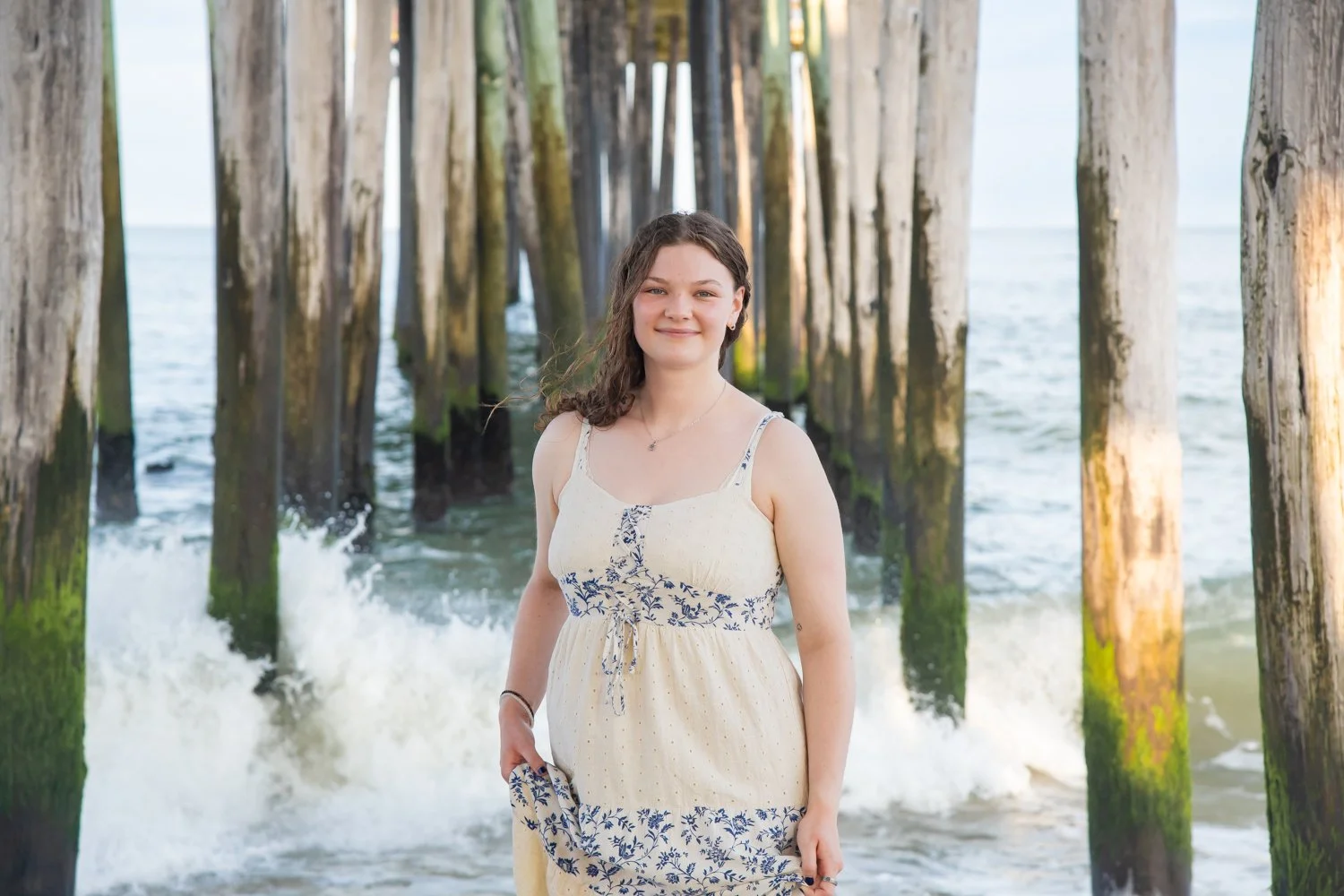 Senior portraits under the pier at the Ocean City, MD Boardwalk by Rayne Photography