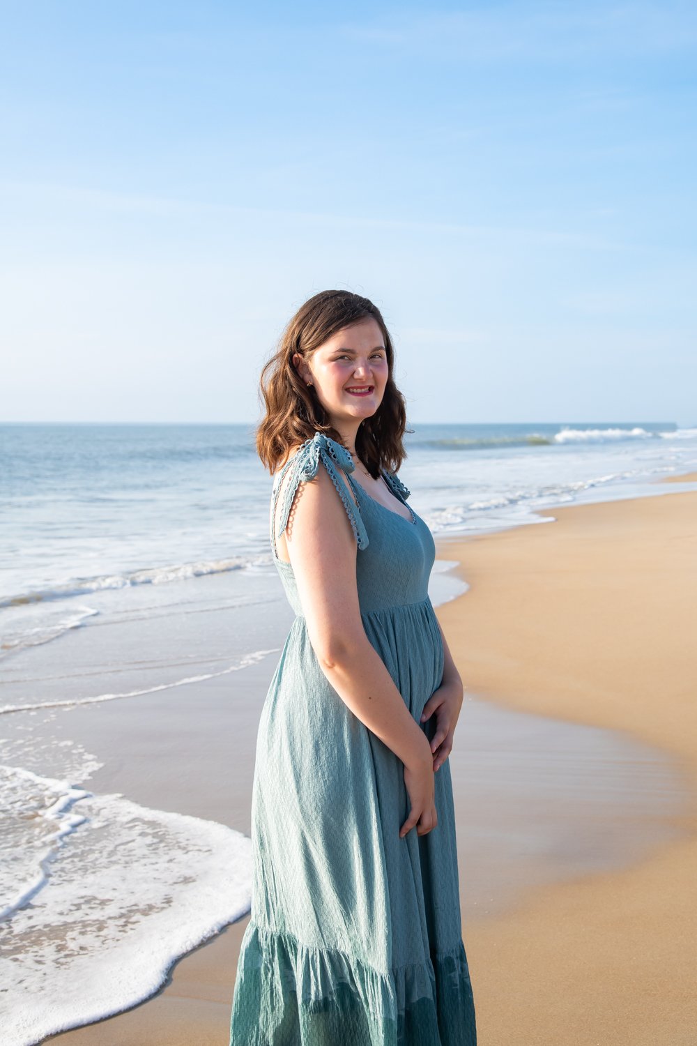Morning and summer senior portraits captured by Rayne Photography on the beach at Bethany Beach, DE