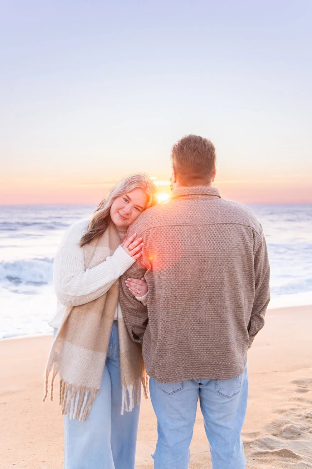 Couple's sunrise photo session on the beach in Ocean City, MD by Rayne Photography