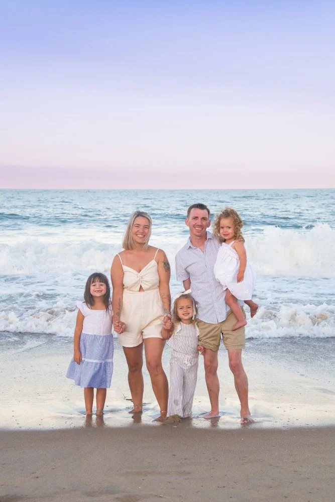 Golden hour photos on the beach with family OC MD