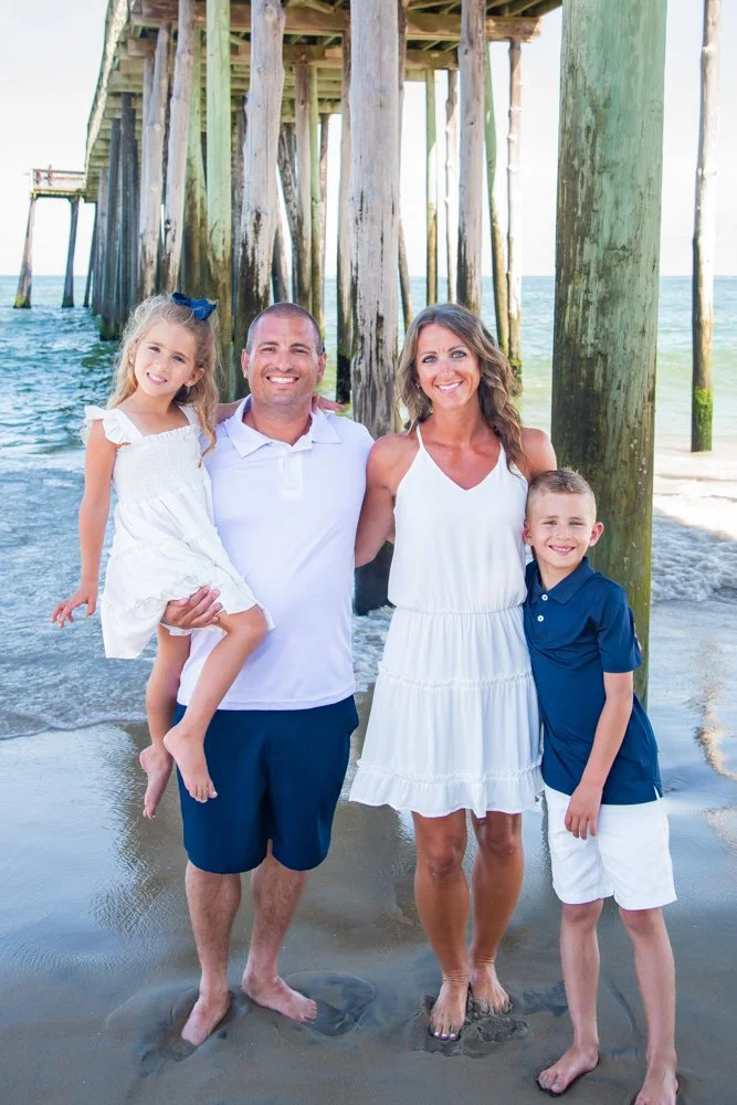 Family pictures under the pier at the Boardwalk in Ocean City, MD
