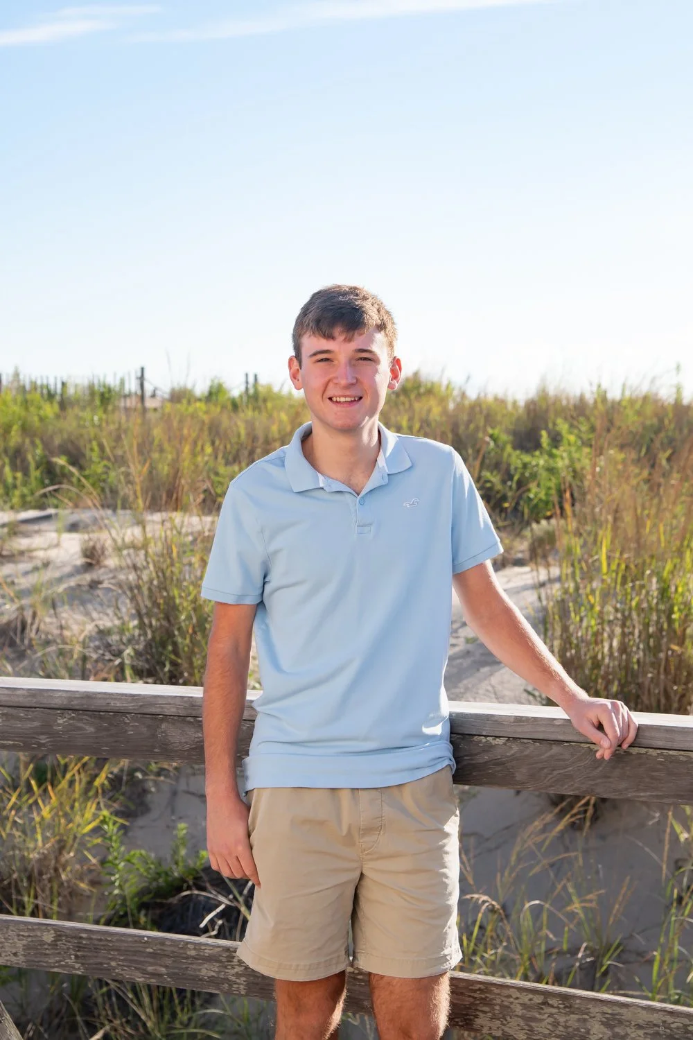Summer senior portrait session on the boardwalk at Bethany Beach, Delaware by Rayne Photography