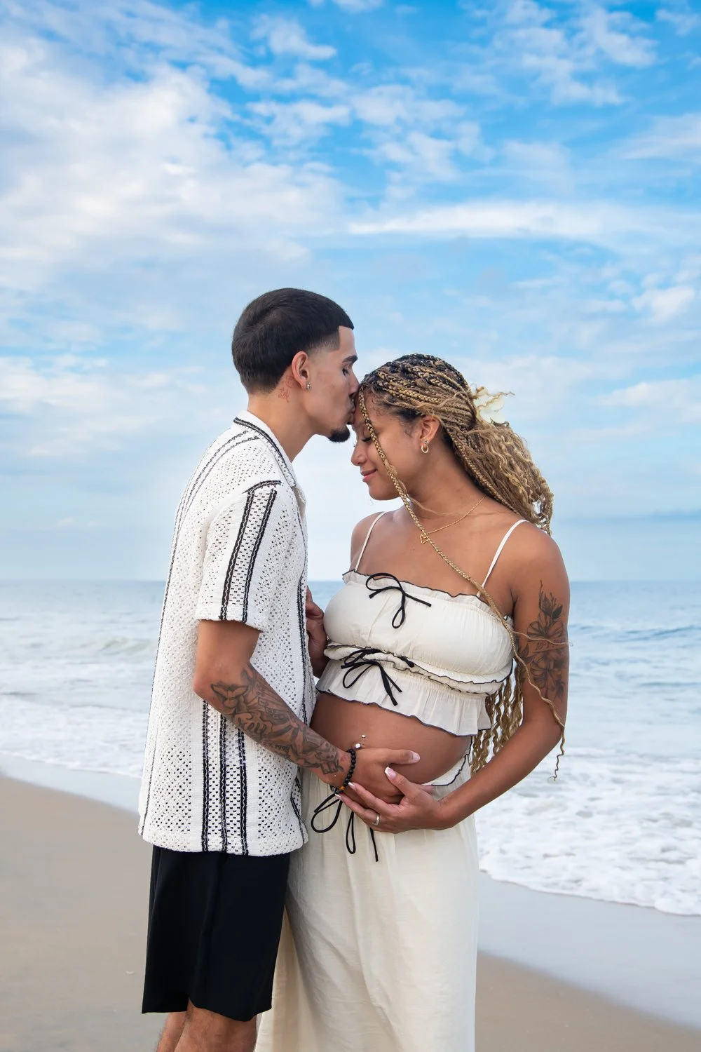 Couples maternity photo session by Rayne Photography on the beach in Ocean City, MD