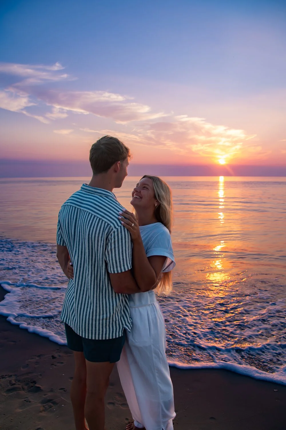 Surprise sunrise engagement session on the beach in Delaware, available at Bethany Beach, Rehoboth, Lewes, Dewy and beyond