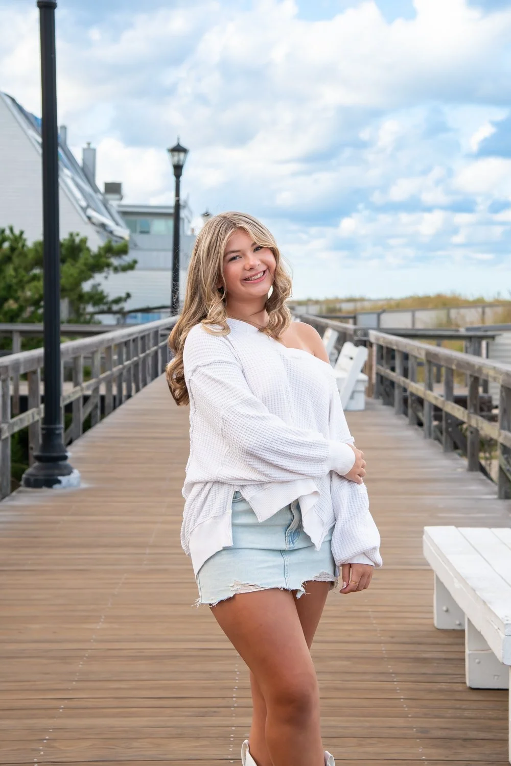 Senior portraits on the boardwalk in Bethany Beach, DE by Rayne Photography