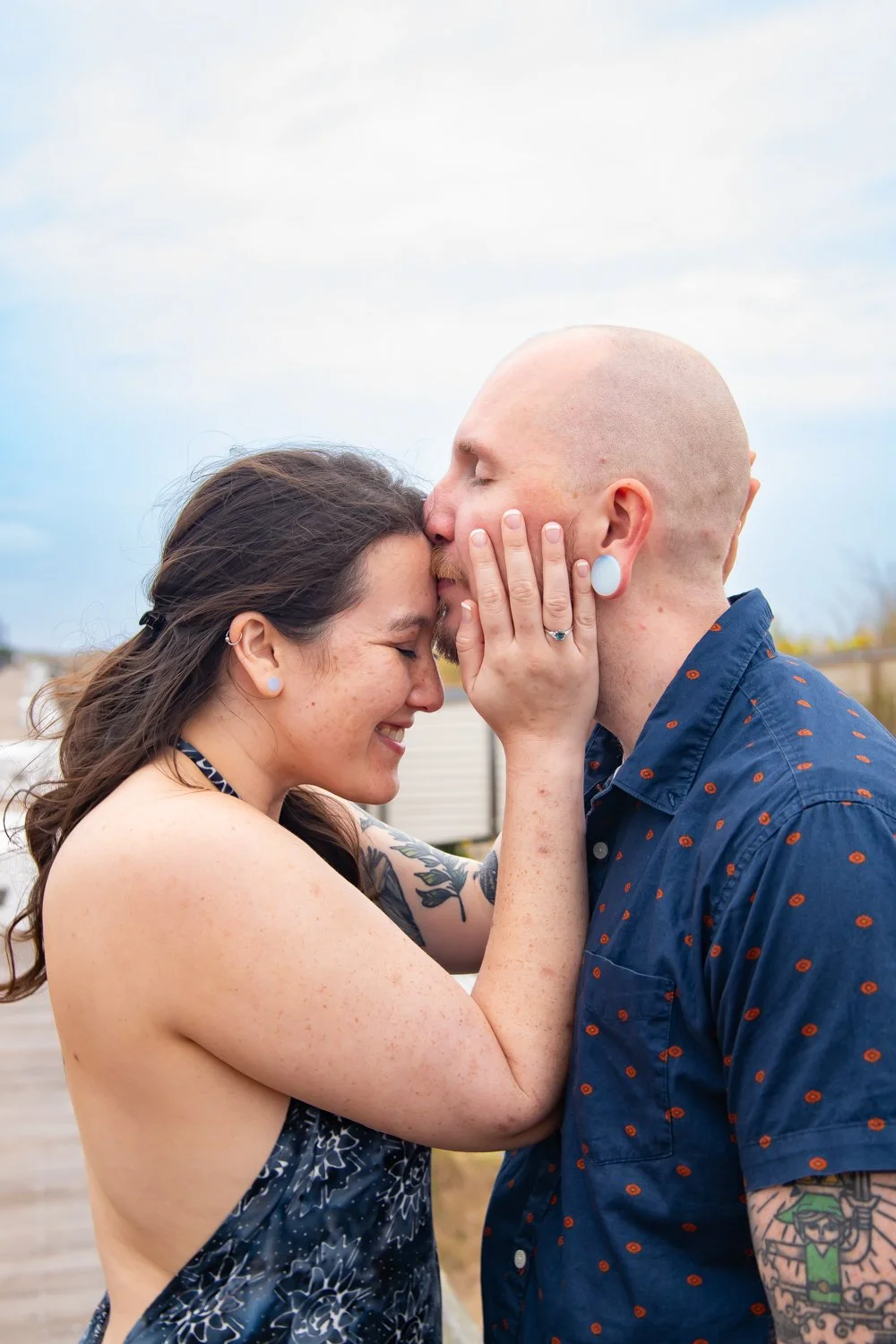 Couples and engagement photography sessions on the Bethany Beach boardwalk by Rayne Photography