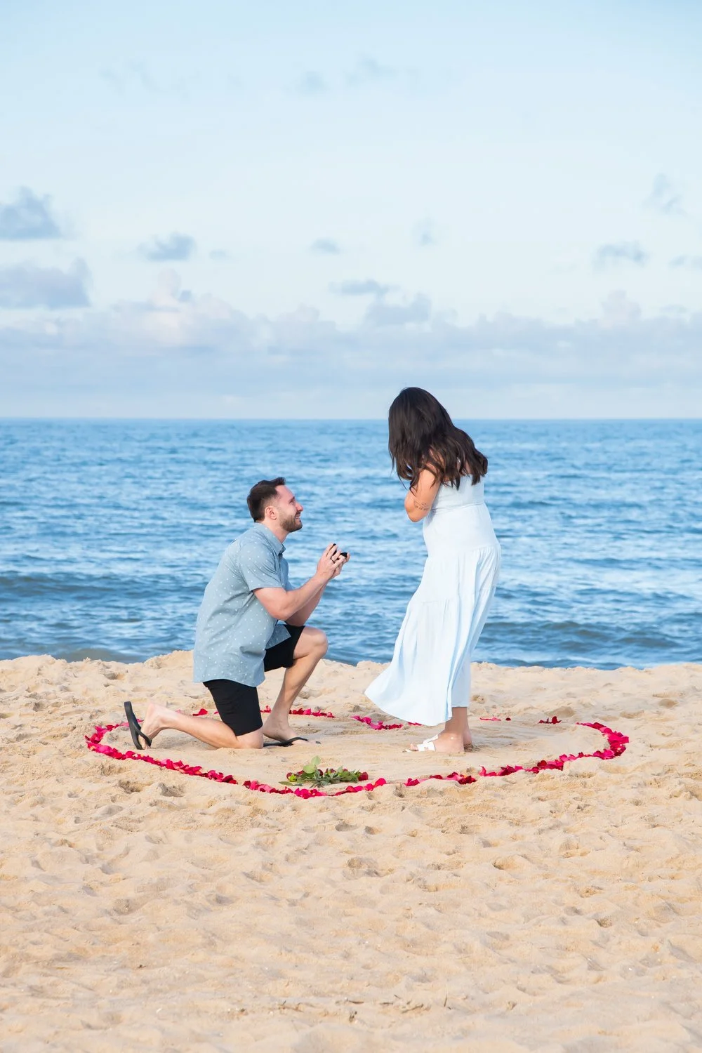 Surprise engagement sessions captured on the beach in Bethany Beach, Delaware by Rayne Photography