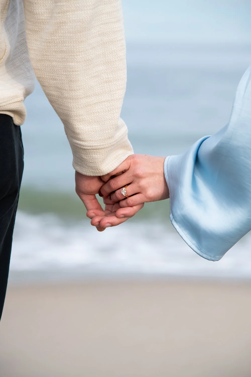 Engagement photo session on the beach in Rehoboth Beach, DE by Rayne Photography